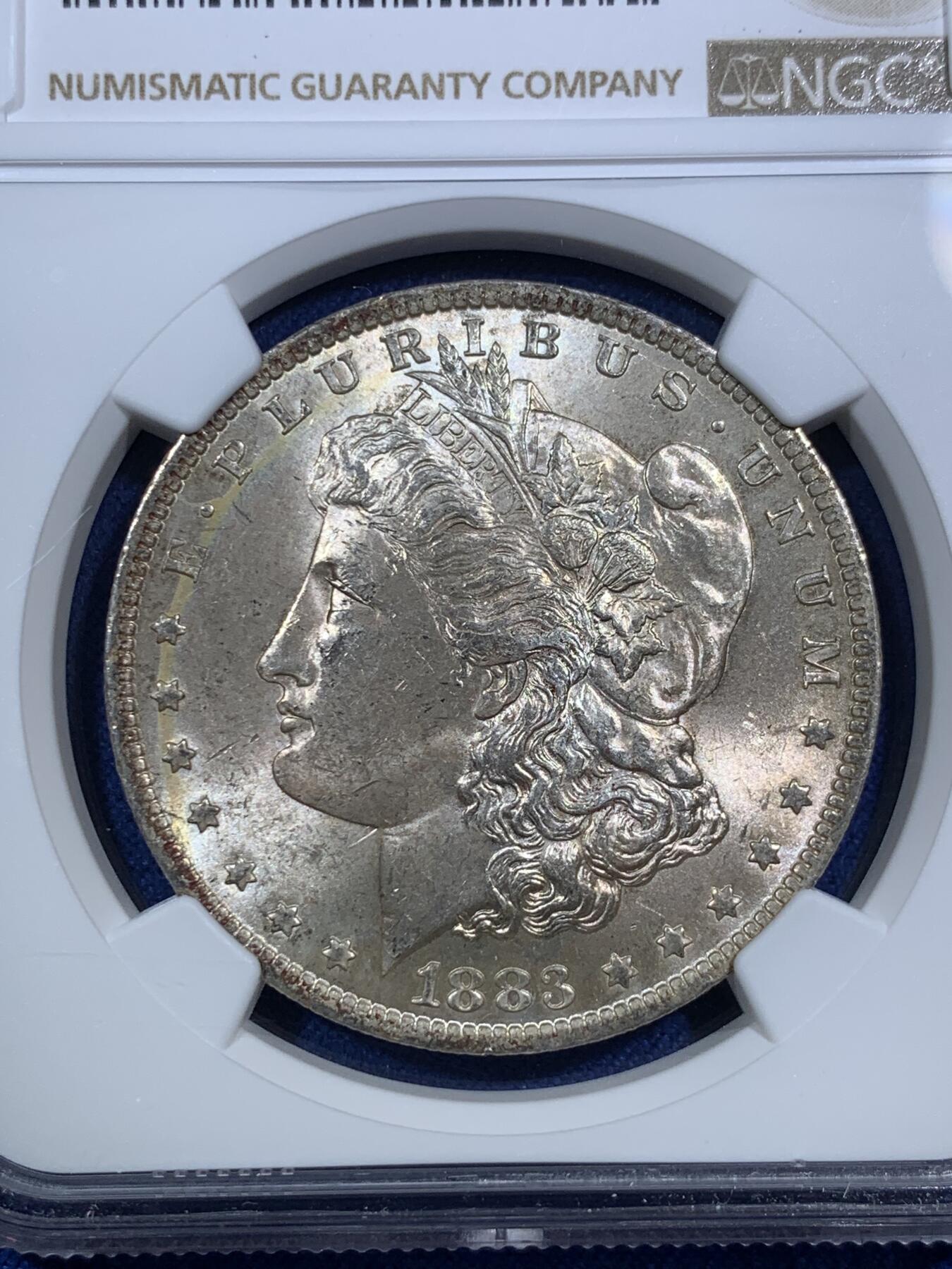 《竞宝斋》第295场- 周日，周一  2场连拍 （全场包邮） NGC MS63 美国1883年O版摩根银币 黄油包浆 光度十足  正面小环彩