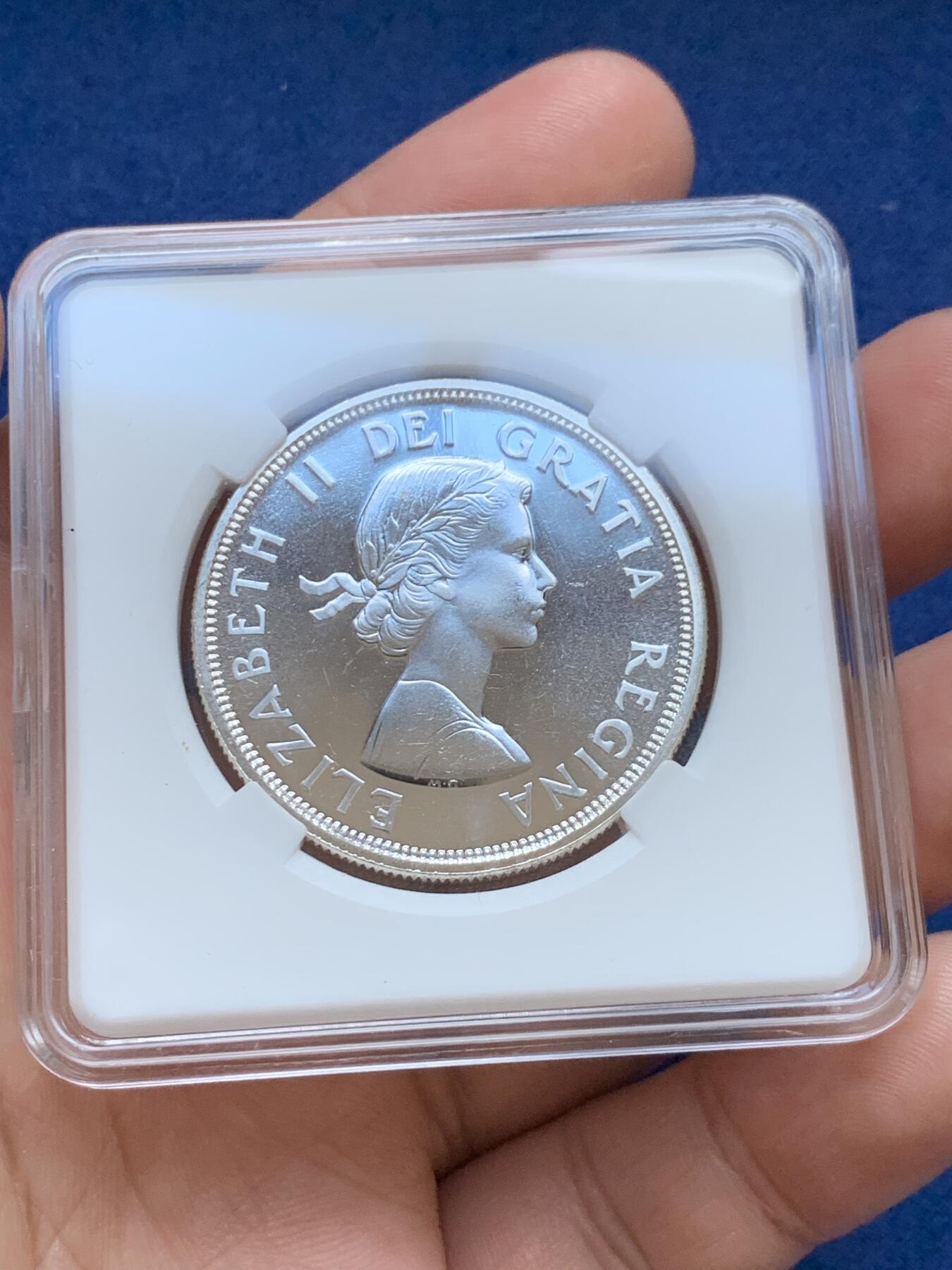 《竞宝斋》第295场- 周日，周一  2场连拍 （全场包邮） 加拿大1964年夏洛特敦百年一元纪念银币 类精制 品相如图