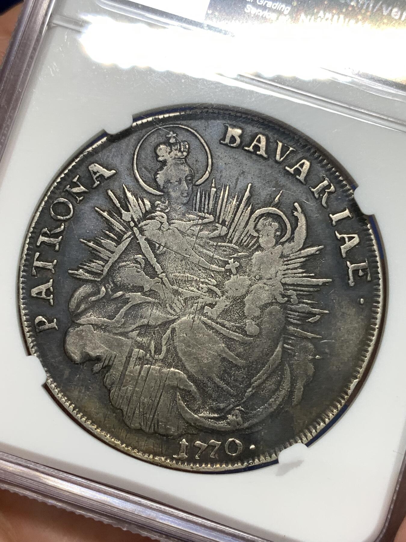 《竞宝斋》第295场- 周日，周一  2场连拍 （全场包邮） NGC XFD 德国巴伐利亚1770年马克西米利安圣母抱婴泰勒银币黑彩包浆