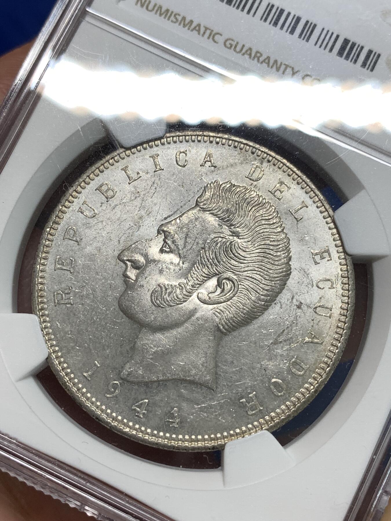 《竞宝斋》第295场- 周日，周一  2场连拍 （全场包邮） NGC MS60 厄瓜多尔1944年5苏克雷克朗大银币 背面带棕灰色包浆 正面转光好