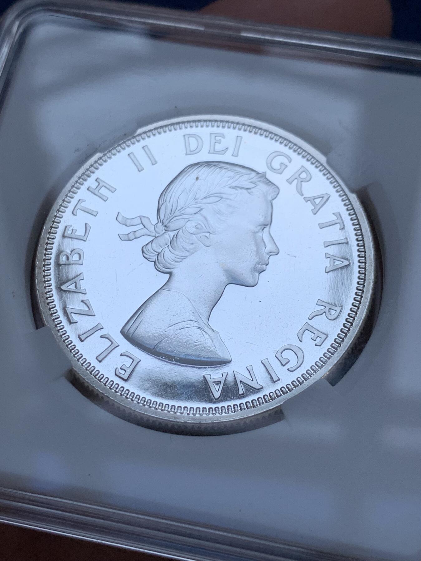 《竞宝斋》第295场- 周日，周一  2场连拍 （全场包邮） 加拿大1964年夏洛特敦百年一元纪念银币 类精制 品相如图