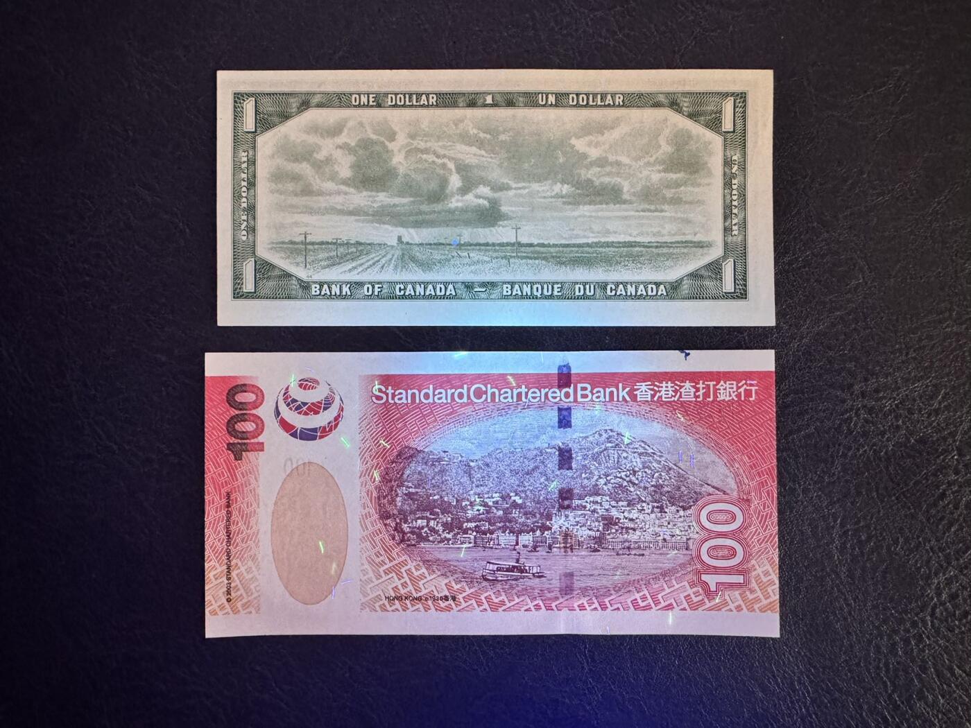 收藏联盟Quantum Auction 第367期拍卖  加拿大1954年1元豹子号和渣打银行2003年100元老虎号 品相UNC-  注意细节图