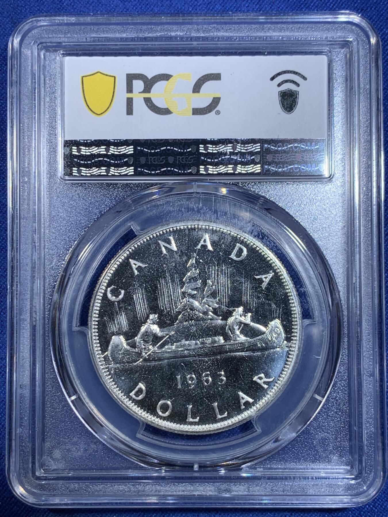 《竞宝斋》第296场- 周日，周一  2场连拍 （全场包邮） PCGS PL66 加拿大1963年独木舟划船1元银币 币面清爽干净又漂亮，类镜面效果，伊丽莎白二世青年头像，经典原住民划船图案，图案精美。