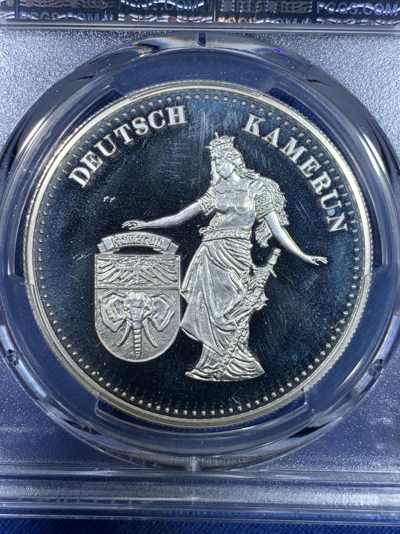 《竞宝斋》第296场- 周日，周一  2场连拍 （全场包邮） PCGS PR68DCAM 亚军分 帕劳1999年 日耳曼妮娅女神 5元精制大银币，纪念德属喀麦隆。克朗型大银，经典女神形象，BU品裸币市价约600元，pc更高分仅1枚