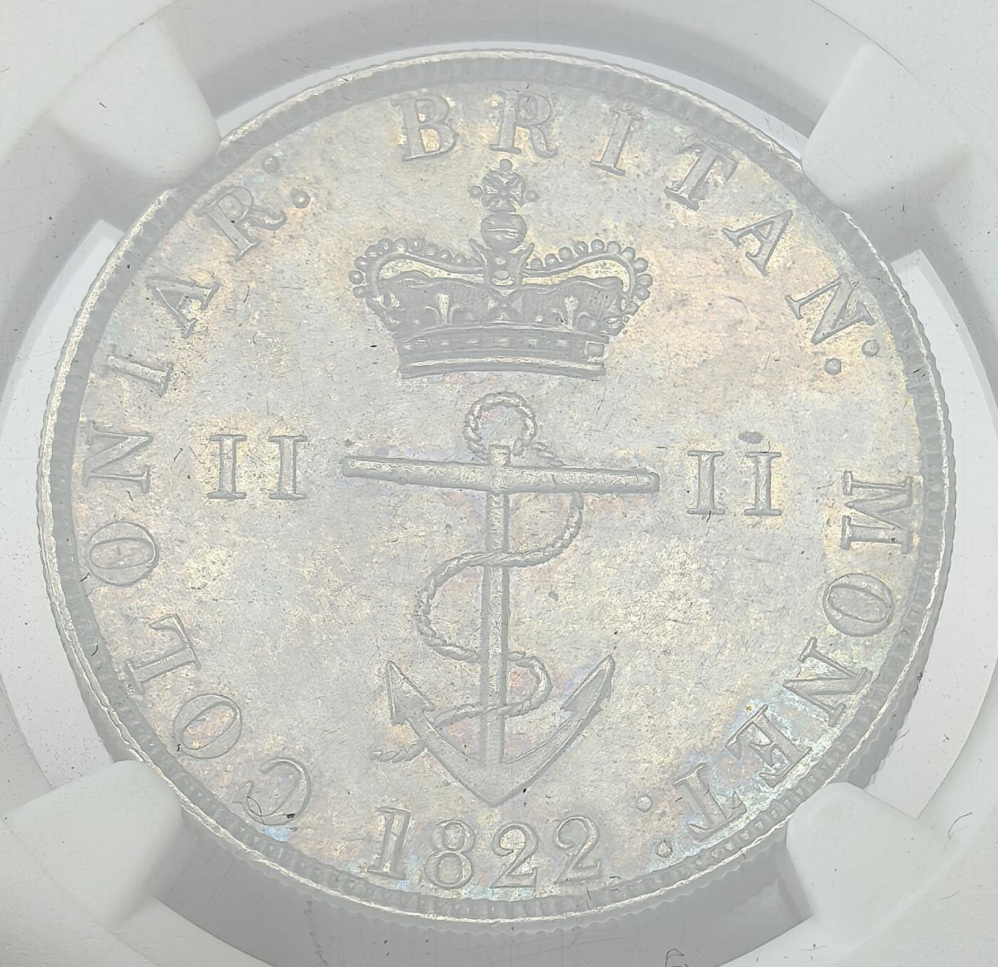 凡希社世界钱币微拍第二百八十期 荐！1822/1英国殖民地锚币1/2元NGC-UNCD，中灰包浆，细节完美，有分没分可能也只在一念之间。英国为各殖民地发行的一套通用货币，规格以墨西哥银元的1/2、1/4、1/8和1/16为标准，其他三种小面值相对常见，唯独1/2，不管哪种品相都稀有，这枚如果在纸袋里放置一段时日，极大概率会有分，去年一枚P63得价5280美金。