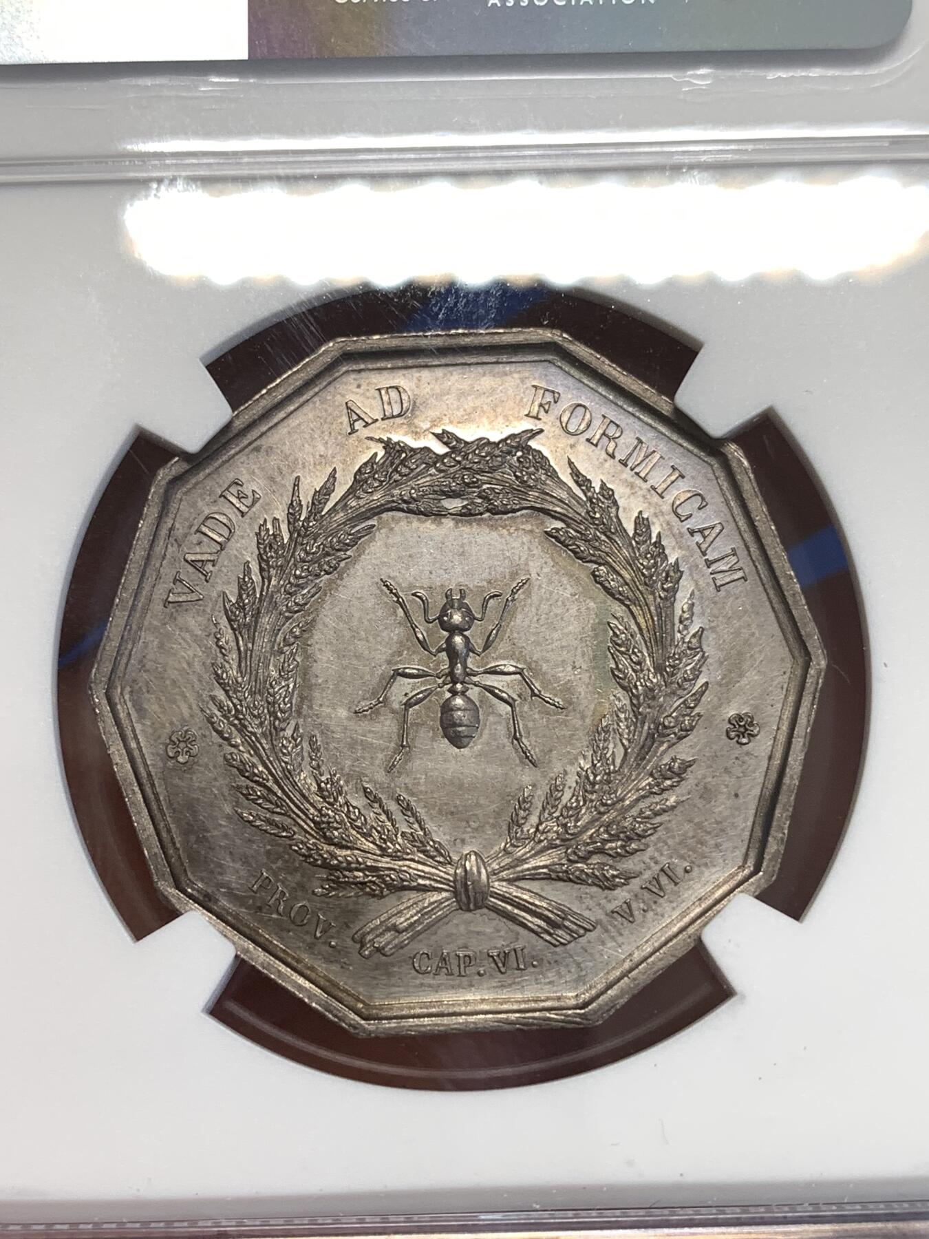 《竞宝斋》第296场- 周日，周一  2场连拍 （全场包邮） NGC UNC 法国里昂储蓄银行八角银质代币 铭文：像蚂蚁般一点点储蓄