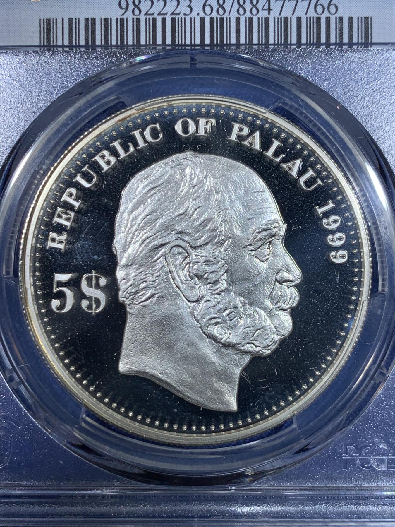 《竞宝斋》第296场- 周日，周一  2场连拍 （全场包邮） PCGS PR68DCAM 亚军分 帕劳1999年 日耳曼妮娅女神 5元精制大银币，纪念德属喀麦隆。克朗型大银，经典女神形象，BU品裸币市价约600元，pc更高分仅1枚