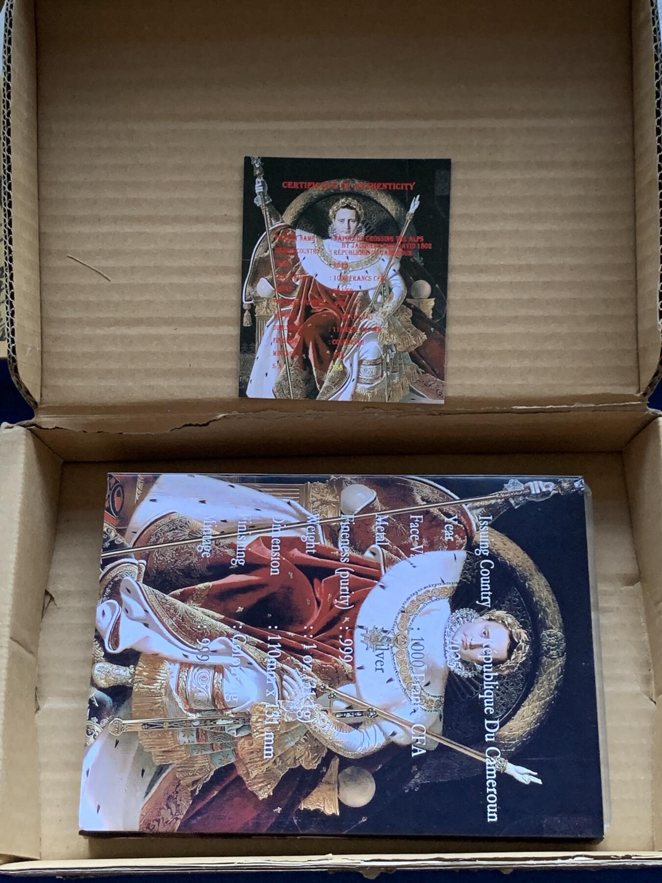 《竞宝斋》第296场- 周日，周一  2场连拍 （全场包邮） 喀麦隆2025年传承之链系列（3）拿破仑双面油画彩钞银币-雅克.路易.大卫《跨越阿尔卑斯山圣伯纳缢道的拿破仑》&让.奥古斯特.多米尼著作的《帝座上的拿破仑》（银币面值1000法郎，限999枚，此枚编号为188号）盒证齐全 精制币 1盎司 999银 110*130mm