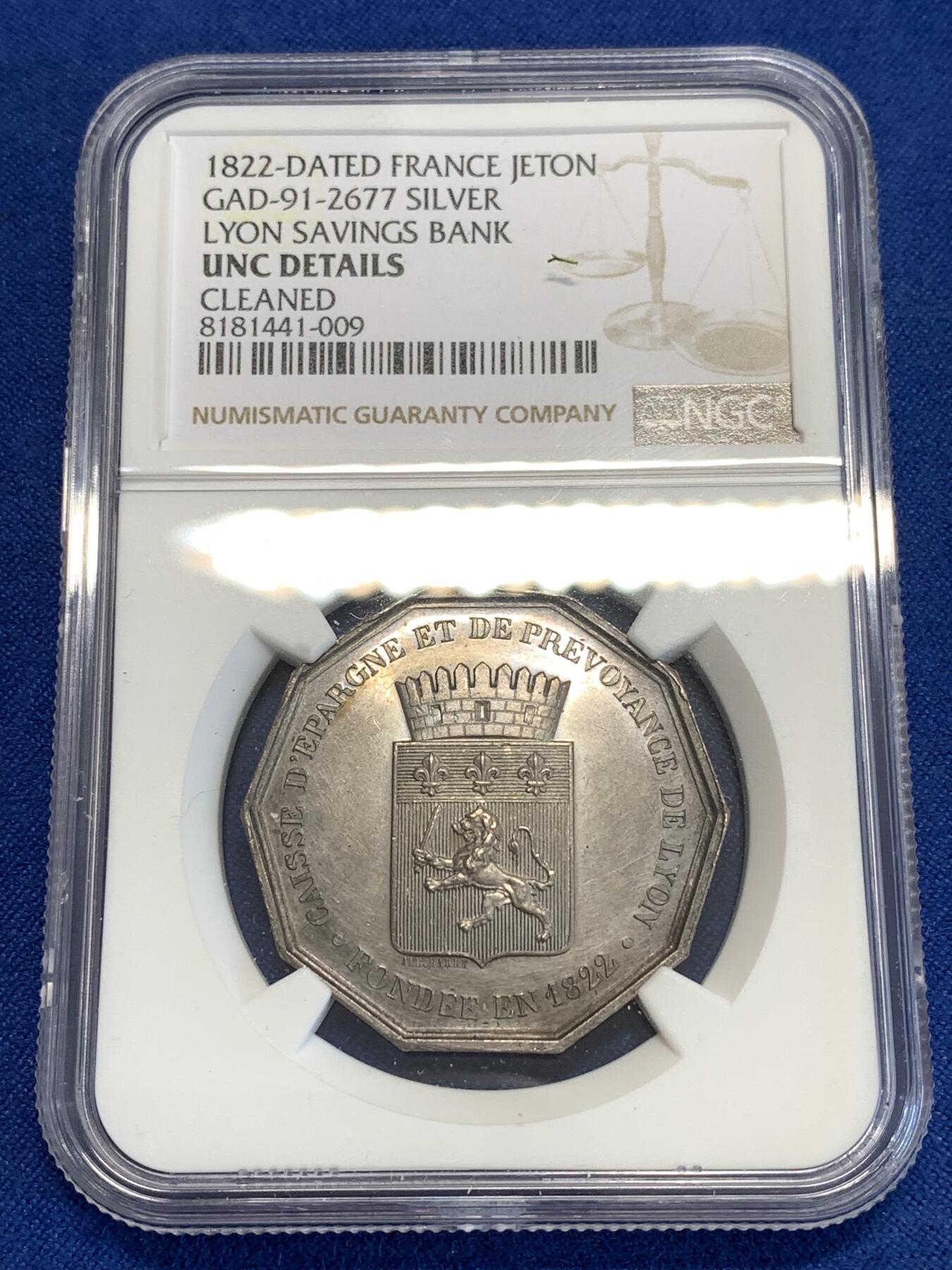 《竞宝斋》第296场- 周日，周一  2场连拍 （全场包邮） NGC UNC 法国里昂储蓄银行八角银质代币 铭文：像蚂蚁般一点点储蓄