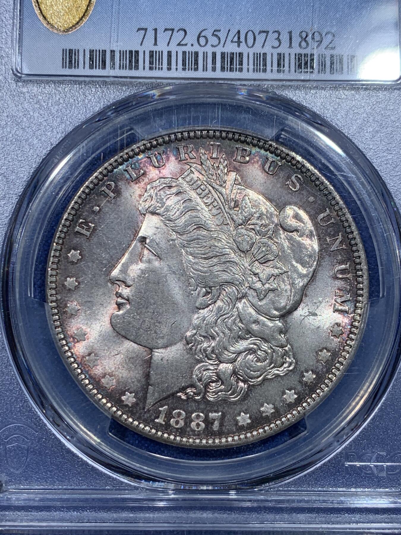 《竞宝斋》第297场- 周日，周一  2场连拍 （全场包邮） PCGS MS65 美国1887年摩根 底板干净 转光强烈 紫罗兰五彩