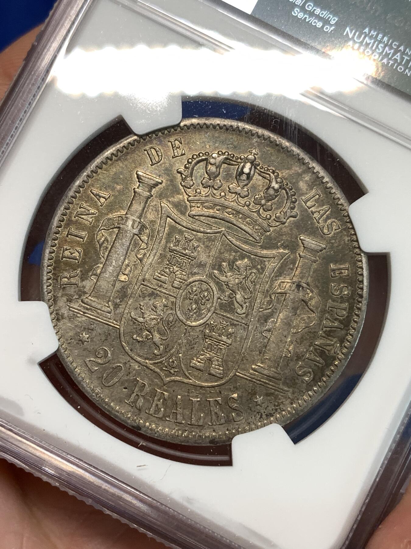 《竞宝斋》第297场- 周日，周一  2场连拍 （全场包邮） NGC AU55 西班牙1856年伊莎贝拉女王20里亚尔大银币 原味黑五彩包浆 非常少见年份 更高分仅3枚
