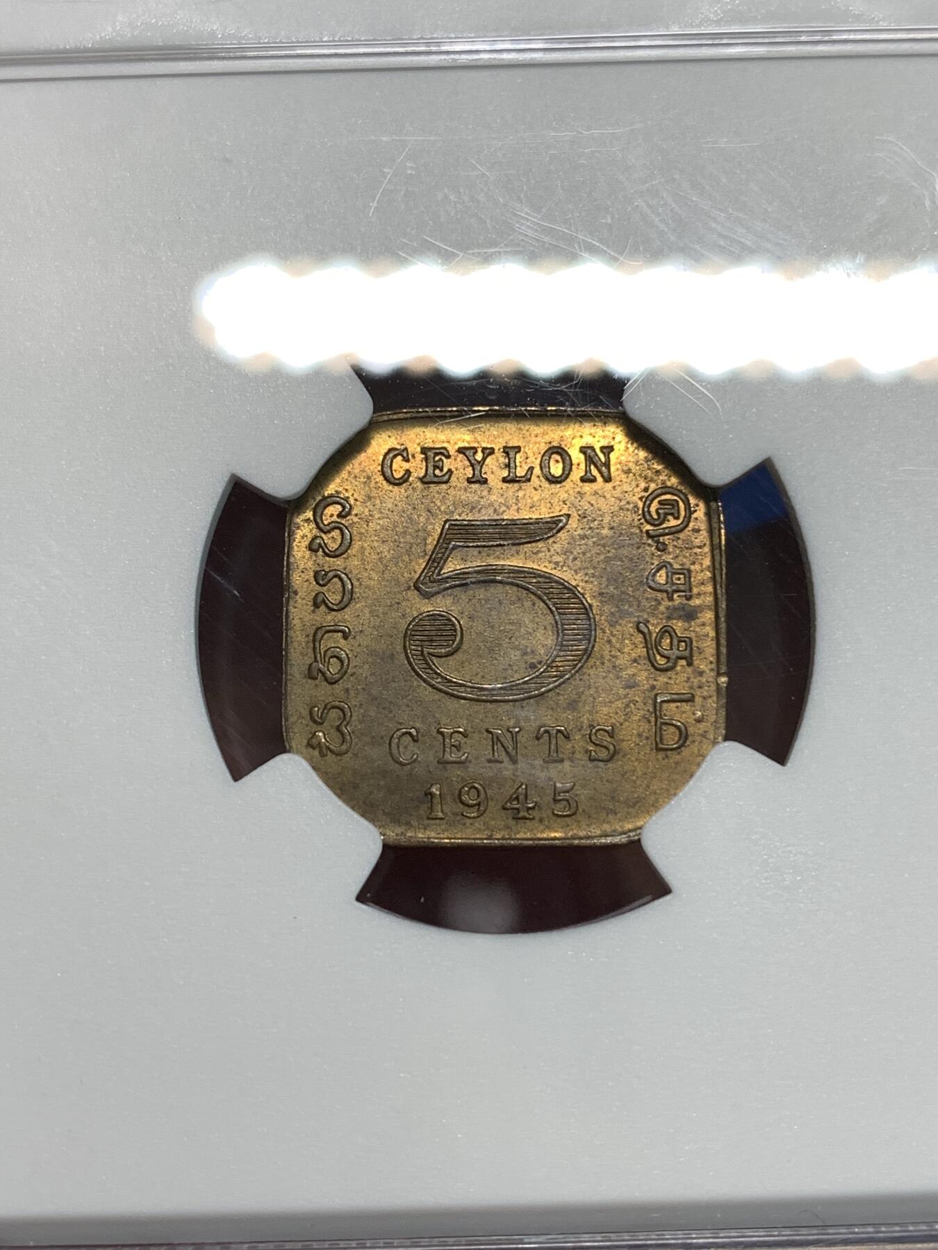 《竞宝斋》第297场- 周日，周一  2场连拍 （全场包邮） NGC MS63 1945锡兰5分 少见的异形铜币 锡兰早期的好品非常困难 两面转光 包浆厚重
