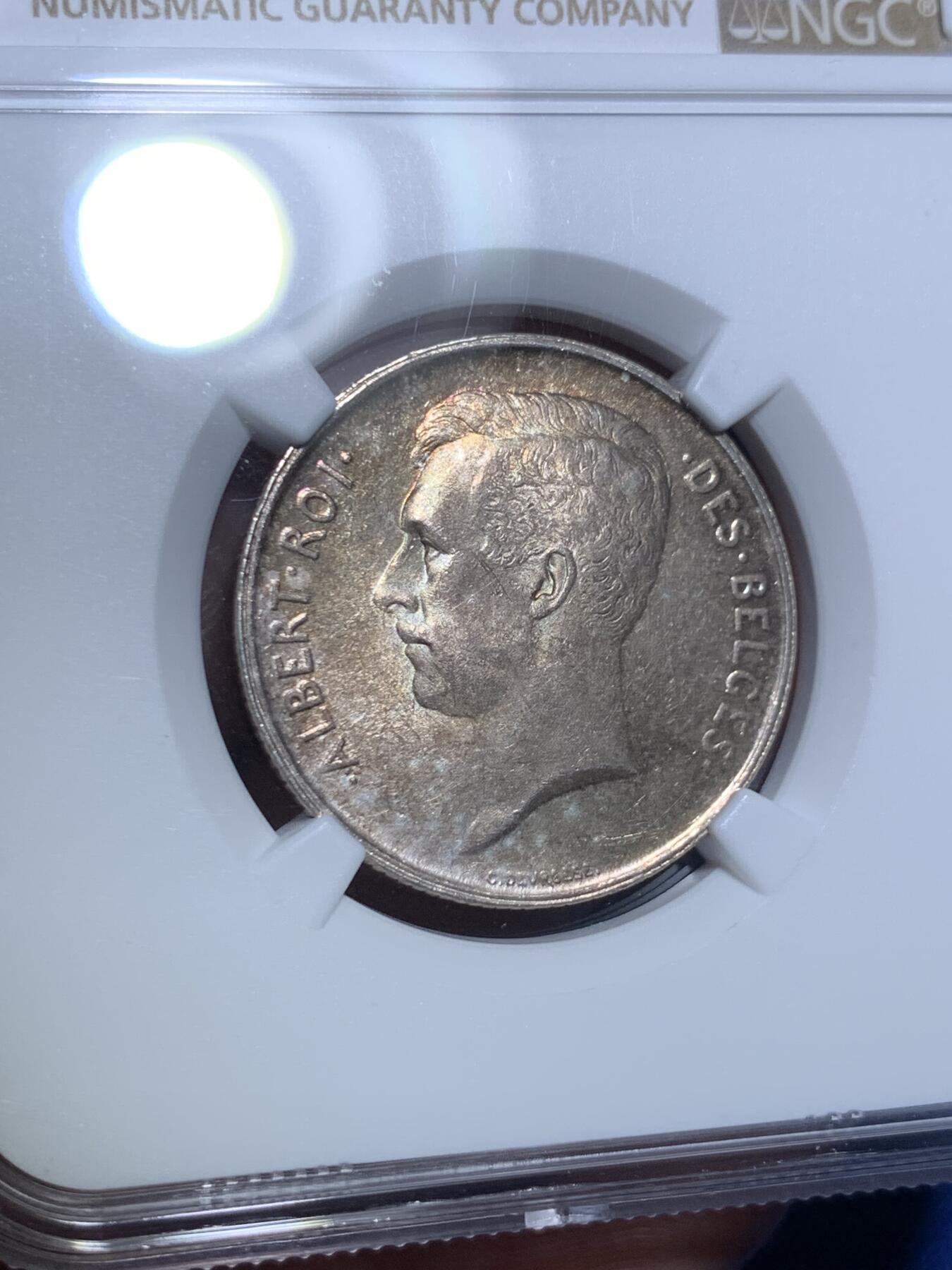 《竞宝斋》第297场- 周日，周一  2场连拍 （全场包邮） NGC MS63 比利时1911年 埃尔佩托 流通2法郎银币，绚丽环彩包浆，顶级状态。只发行了2年的品种，流通充分，更高分仅有4枚