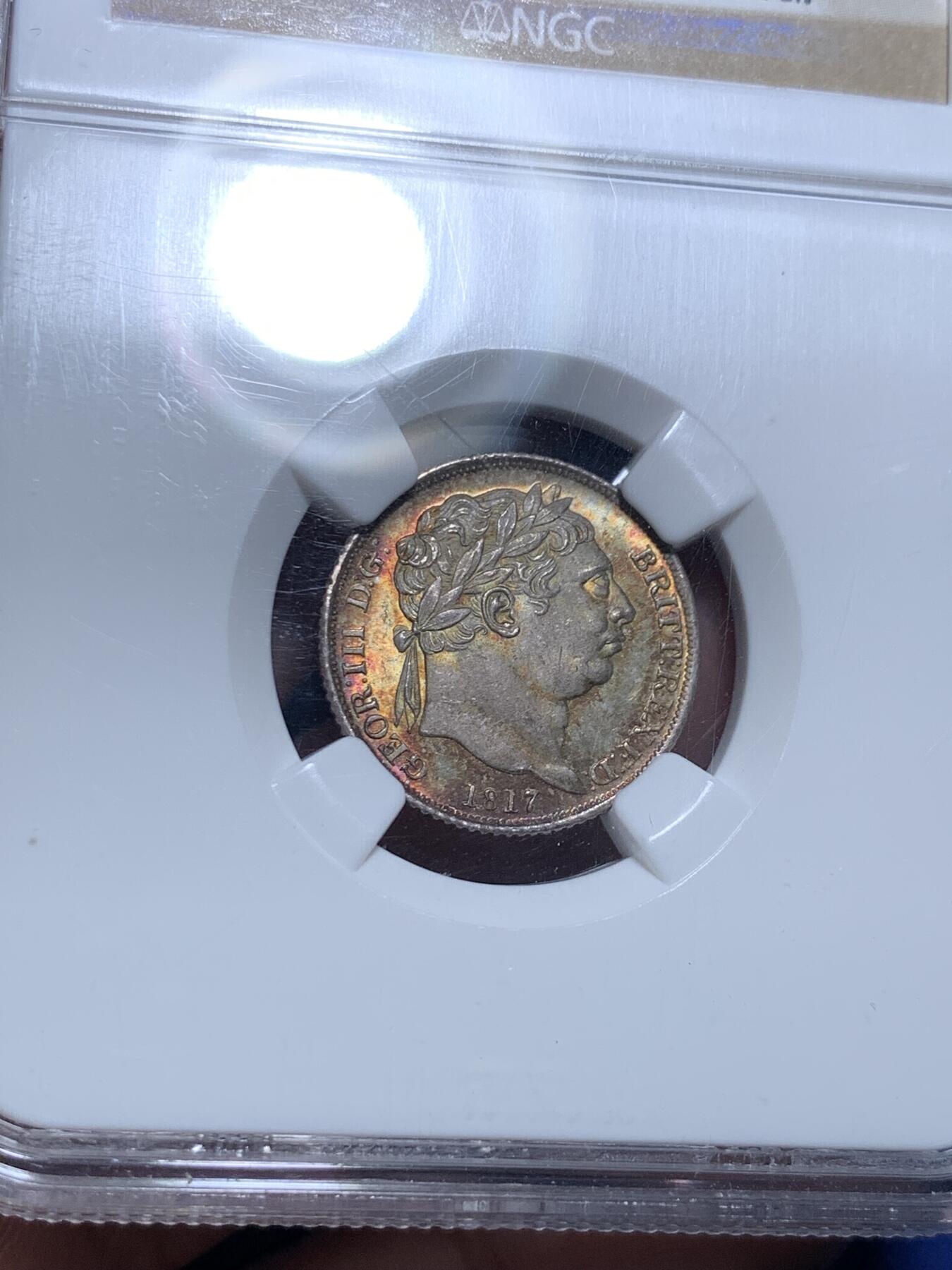 《竞宝斋》第297场- 周日，周一  2场连拍 （全场包邮） NGC MS65 1817年英国乔三牛头6便士银币，乔治三世。正面爆炸绚烂五彩，背面欧陆灰包浆。65收藏级高分，老N盒品质保障