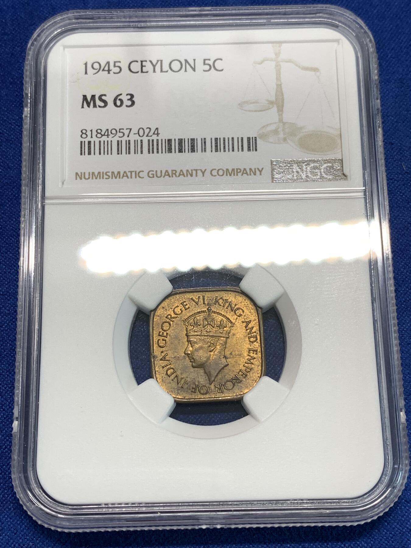 《竞宝斋》第297场- 周日，周一  2场连拍 （全场包邮） NGC MS63 1945锡兰5分 少见的异形铜币 锡兰早期的好品非常困难 两面转光 包浆厚重