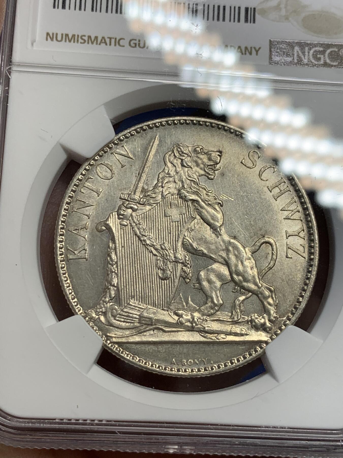 《竞宝斋》第297场- 周日，周一  2场连拍 （全场包邮） NGC UNC 瑞士1867年施维茨射击节5法郎银币 发行量8000枚 底板和光感都不错，可以试试砸盒养养包浆
