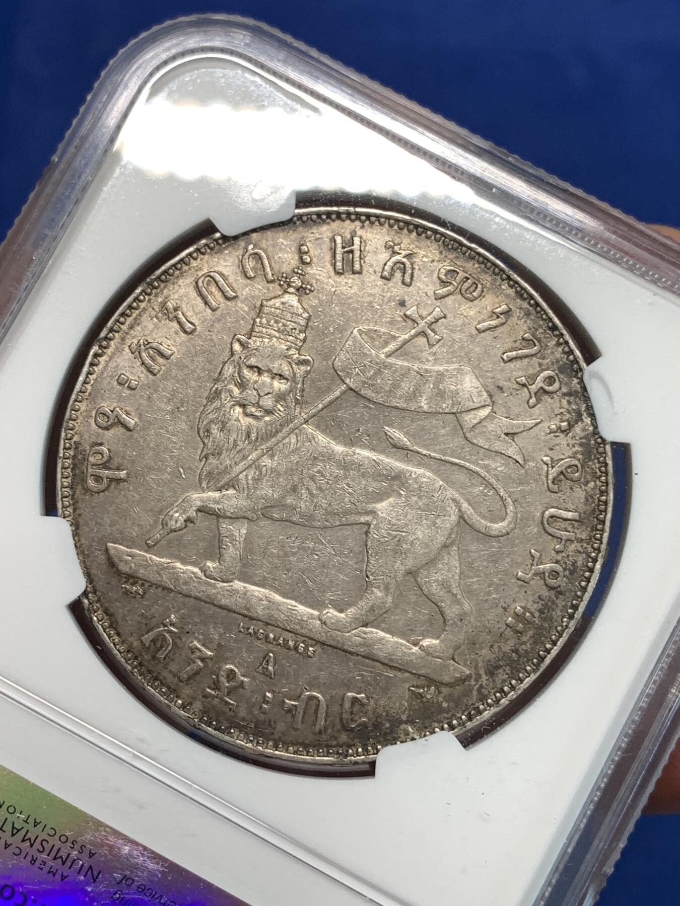 《竞宝斋》第297场- 周日，周一  2场连拍 （全场包邮） NGC AUD 埃塞俄比亚1889年1比尔狮子抗旗银币 黑五彩包浆 细节清晰，磨损小