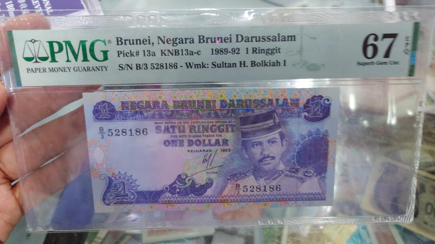 【世界钱币】精选微拍第128期暨2024年第39期  部分评级币，裸钞历史库存较低价起拍 1989年文莱1林吉特 全新绝品无47PMG67E