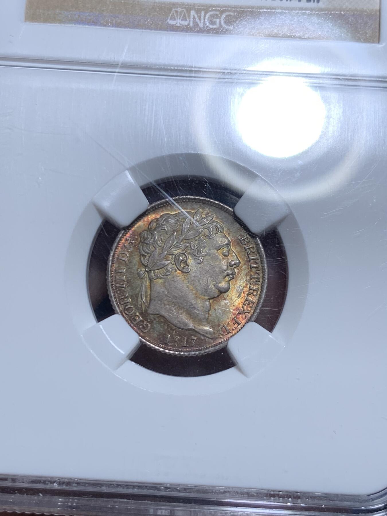 《竞宝斋》第297场- 周日，周一  2场连拍 （全场包邮） NGC MS65 1817年英国乔三牛头6便士银币，乔治三世。正面爆炸绚烂五彩，背面欧陆灰包浆。65收藏级高分，老N盒品质保障