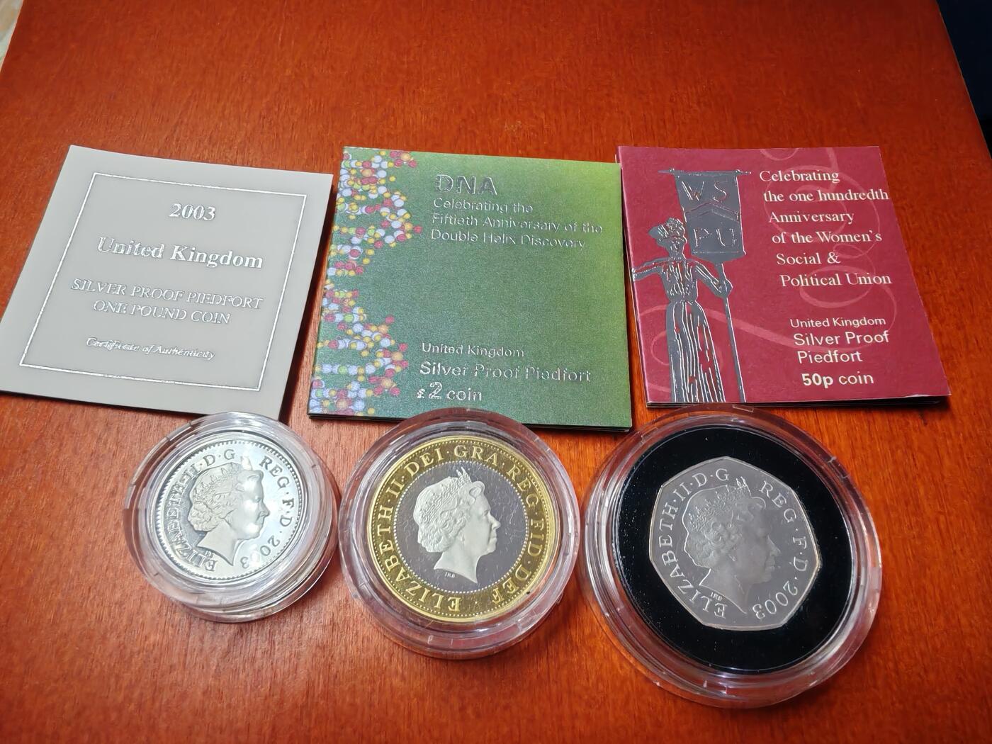 长老汇龙年精选第二十三场拍卖 2003英国妇女选举权50便士精制加厚银币（7500）+1英镑精制加厚银币（1万）+DNA2英镑双色加厚精制银币（1万），盒证全