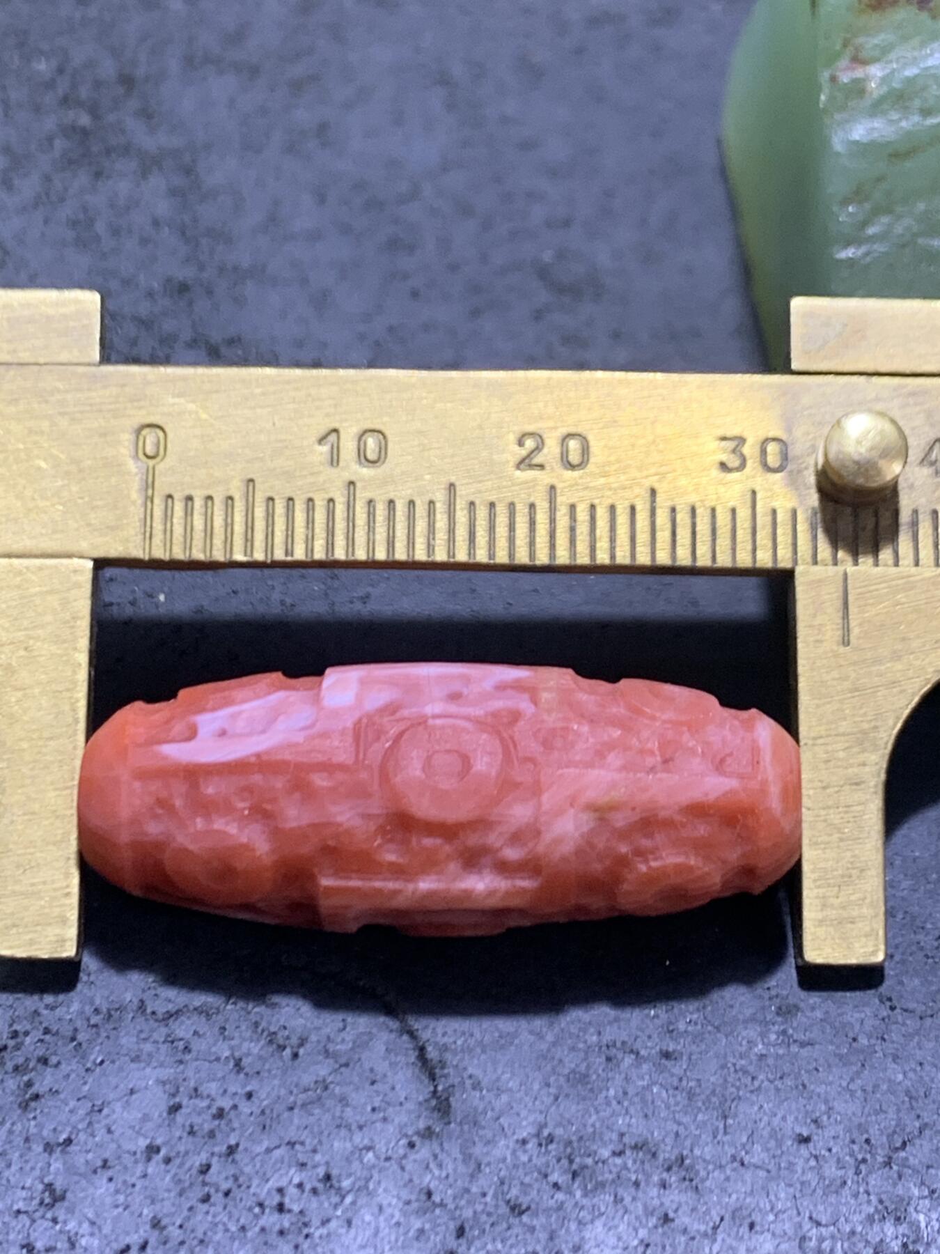 精美川料亚光南红玛瑙雕刻九眼天珠一个，
