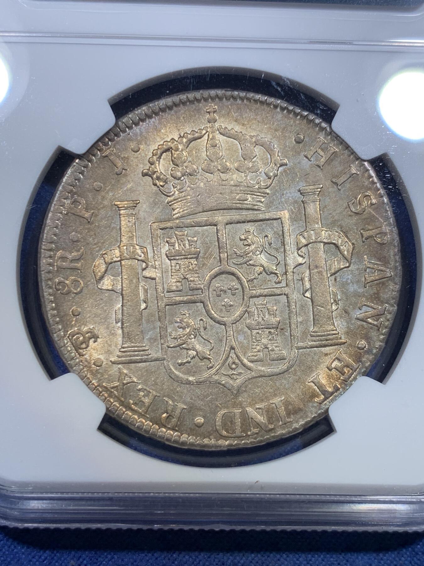 《竞宝斋》第298场- 周日，周一  2场连拍 （全场包邮） NGC AU58 玻利维亚1804年卡洛斯四世8里亚尔银币 高点细节具在，底板几近无痕 光感强烈 币面环状五彩黄油光包浆 非常漂亮，严重低评的一枚