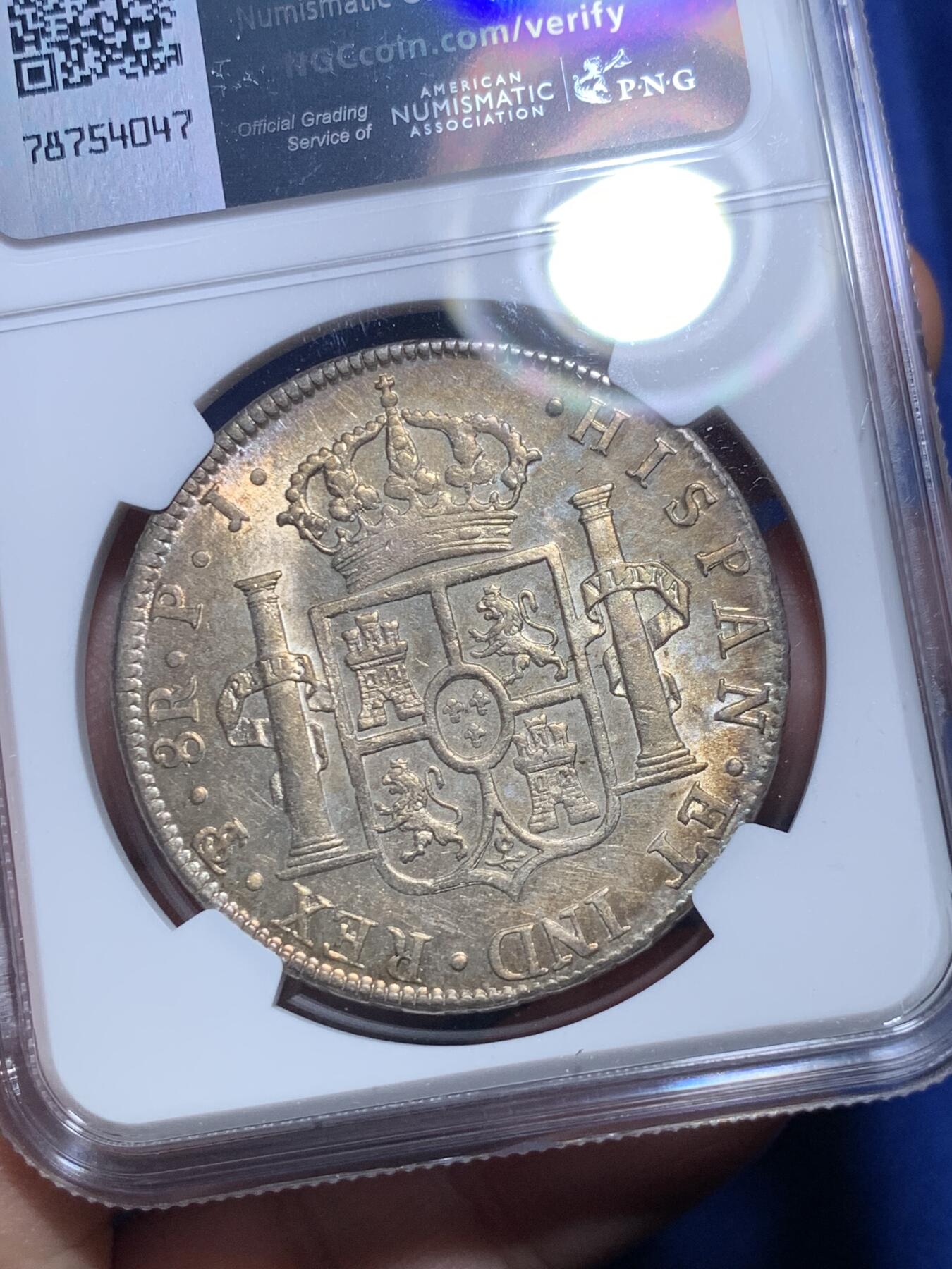 《竞宝斋》第298场- 周日，周一  2场连拍 （全场包邮） NGC AU58 玻利维亚1804年卡洛斯四世8里亚尔银币 高点细节具在，底板几近无痕 光感强烈 币面环状五彩黄油光包浆 非常漂亮，严重低评的一枚
