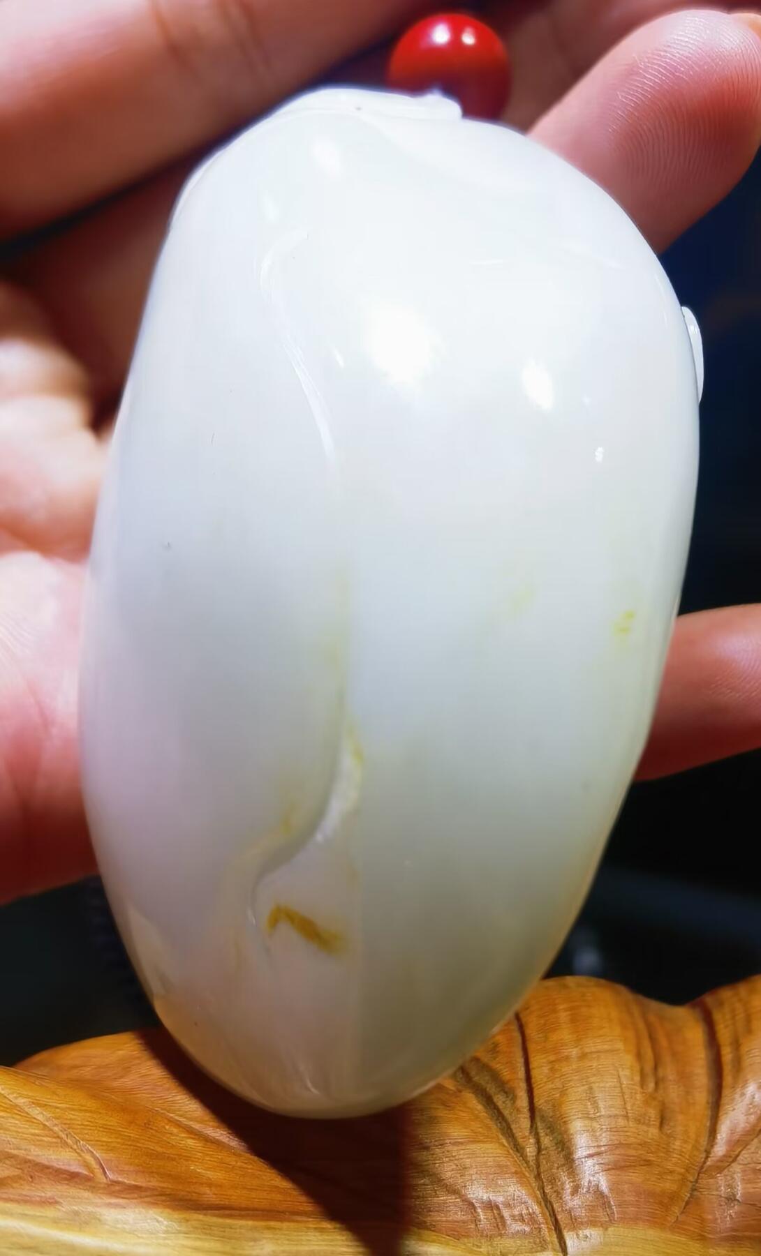 和田玉手把件童子献寿福在眼前