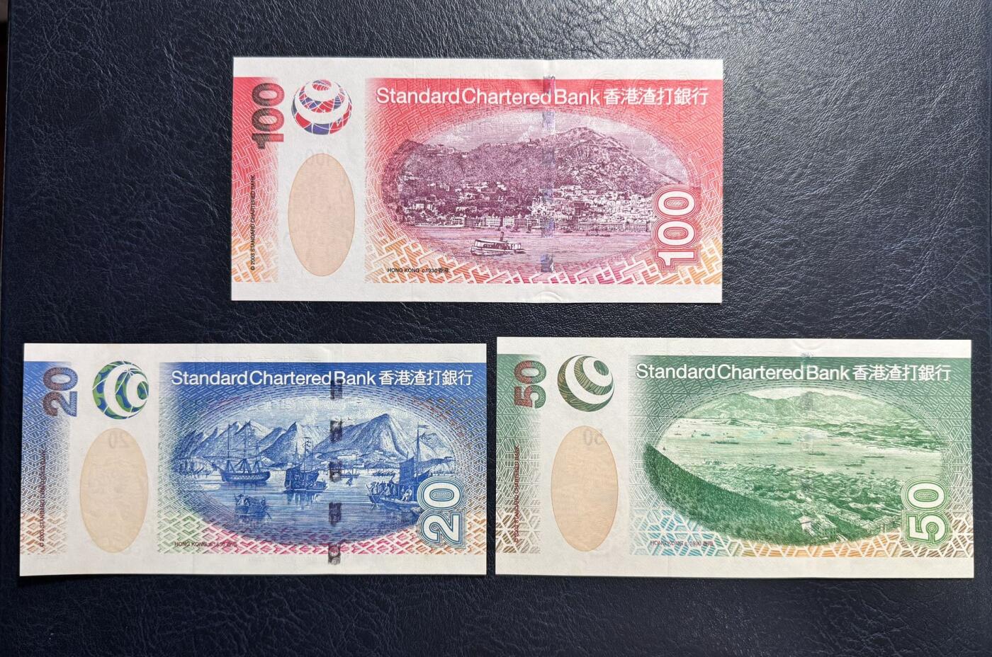 收藏联盟Quantum Auction 第372期拍卖  香港渣打银行2003年20-1000元首发AA冠尾二同 品相UNC 20到100元边缘有轻微黄斑和荧光