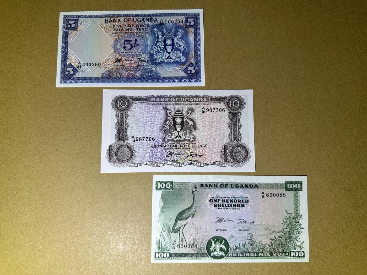 《张总收藏》165期-周日外币超精品 乌干达5、10、100先令3张 UNC- 1966年第一套纸币 局部泛黄荧光 全程无4