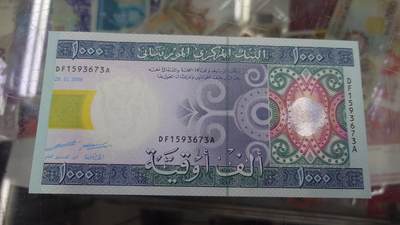 【世界钱币】精选微拍第132期暨2024年第43期  各类库存杂货 2006年毛里塔尼亚1000乌吉 全新绝品无4尾号673