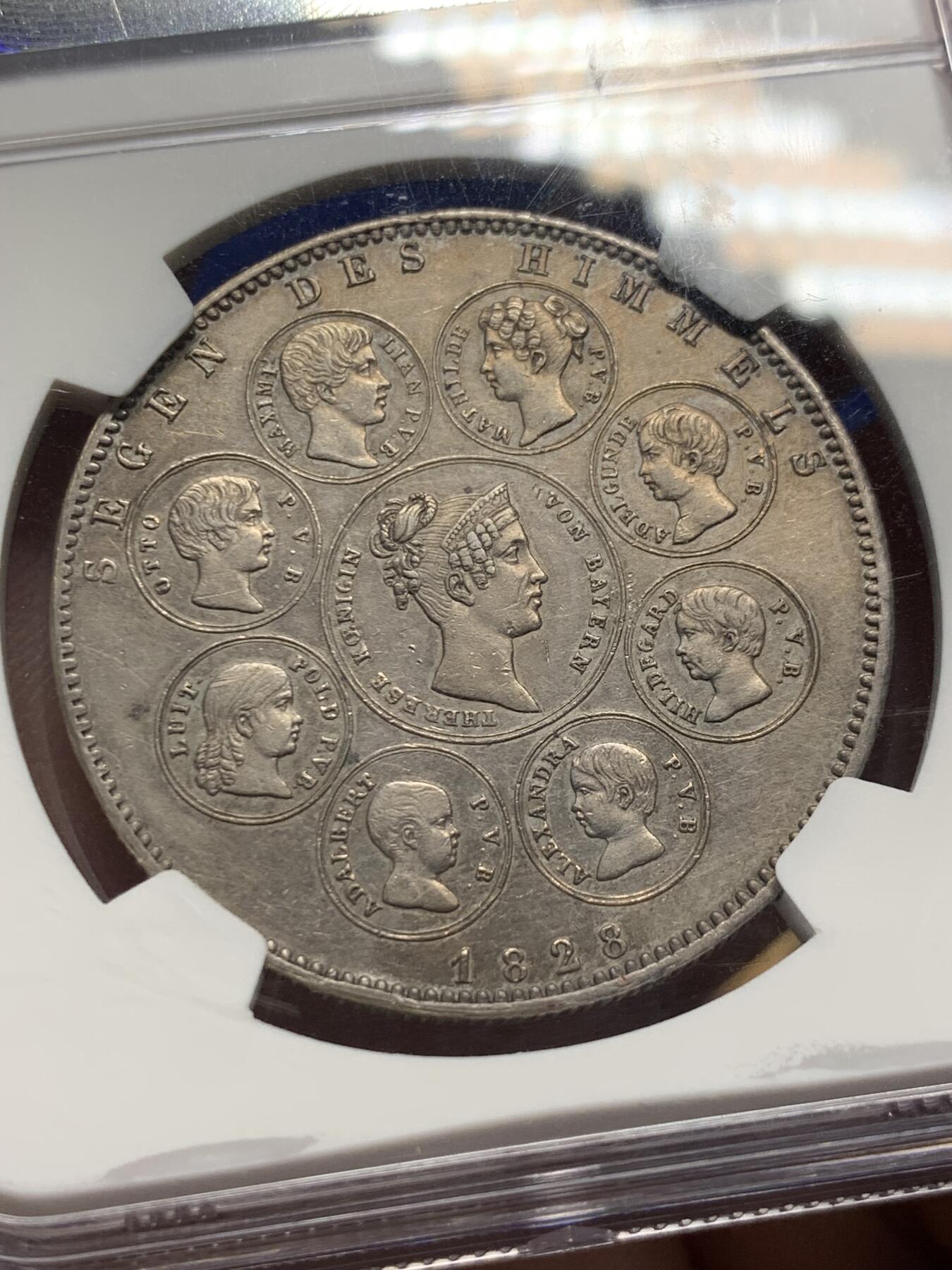 《竞宝斋》第303场   周日，周一 2场连拍 （全场包邮） NGC AU55 德国 巴伐利亚1828年 祝福王室历史协定泰勒大银币 背面中央为王后特蕾莎头像，其四周是八位子女头像 原味带彩 细节非常好