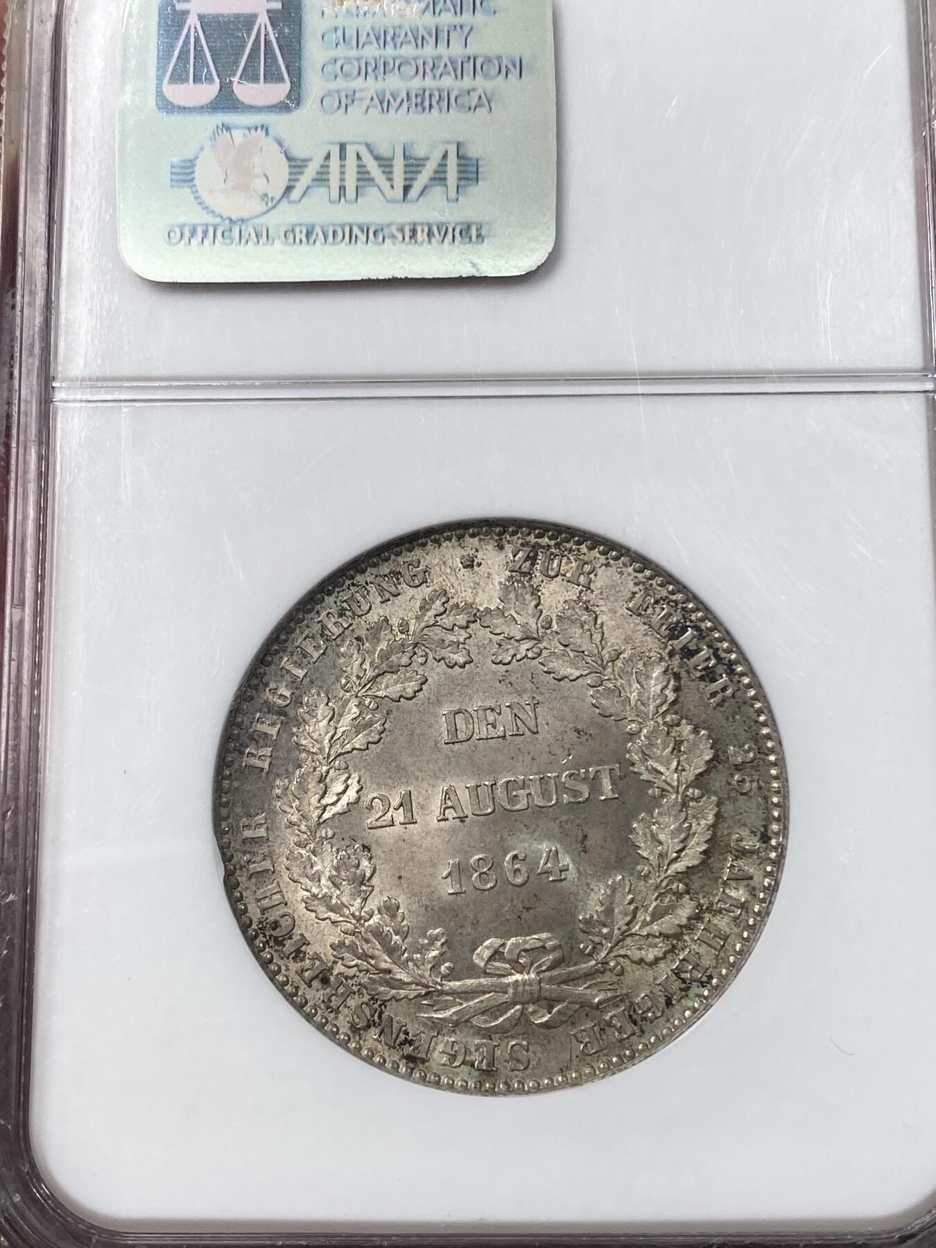 万国钱币拍卖第033期 NGC MS64 1864年德国拿骚阿道夫公爵登基25周年纪念流通1泰勒 原味纸袋包浆也盖不住其原光迸发 N记老盒值得典藏
