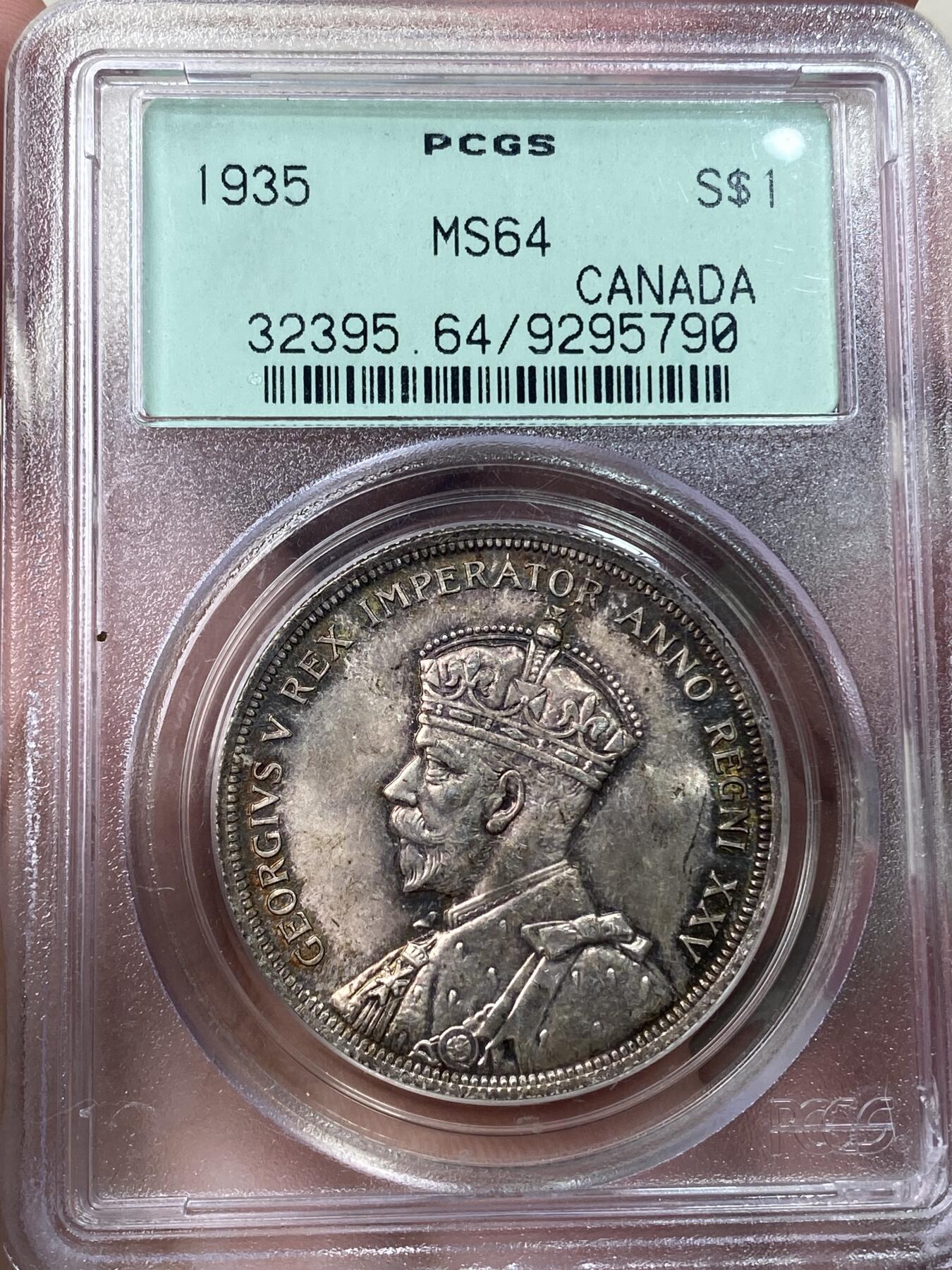 万国钱币拍卖第033期 PCGS MS64 1935英属加拿大乔治五世划船一元 原味五彩转光