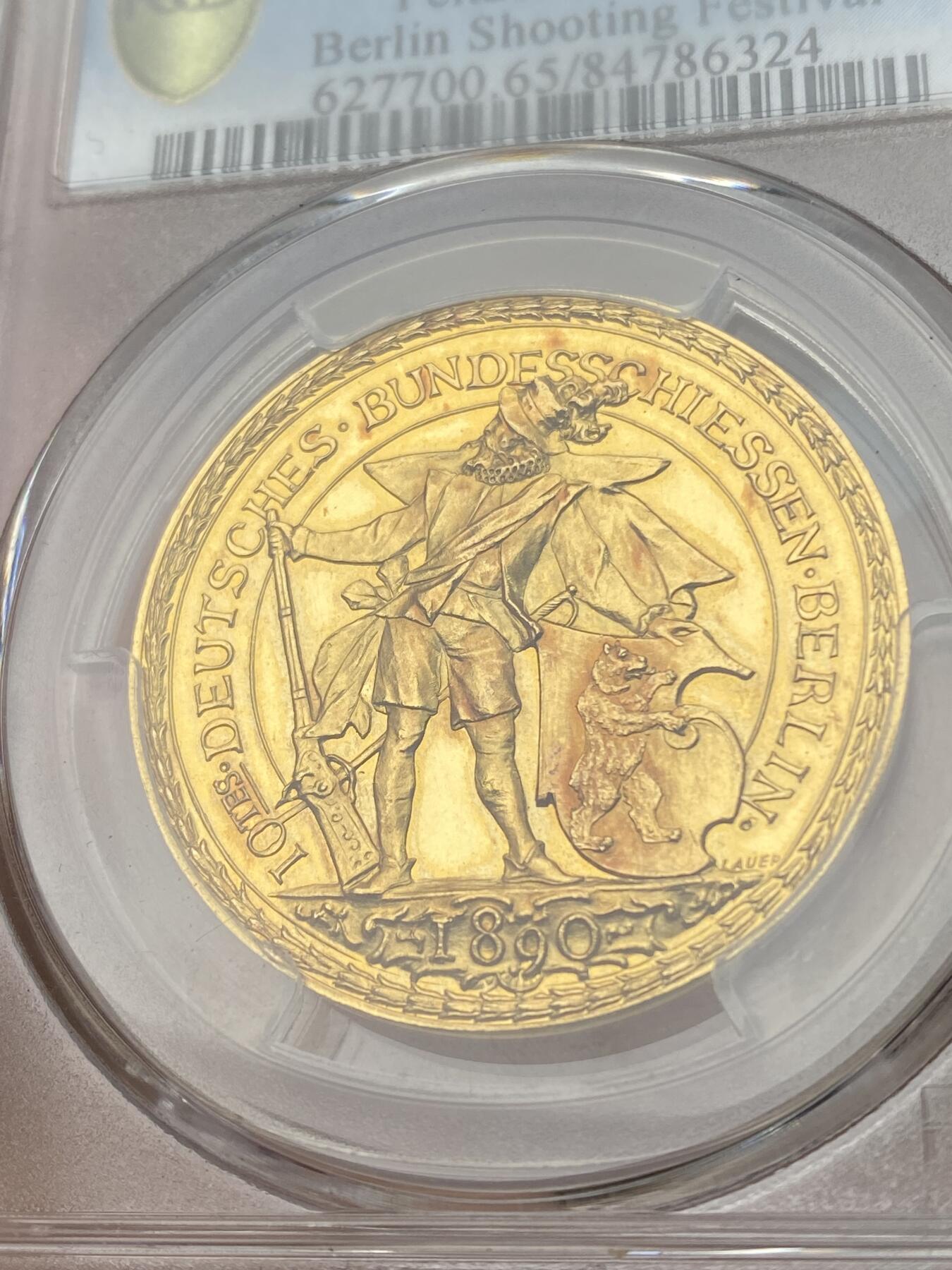 万国钱币拍卖第033期 PCGS SP65 1890年德国柏林联邦射击节纪念大金章，5杜卡特，33MM，16G左右，名誉品种，大尺寸德射金章极其难得，超高浮雕，镜面底板，PC唯一冠军&封面广告章。