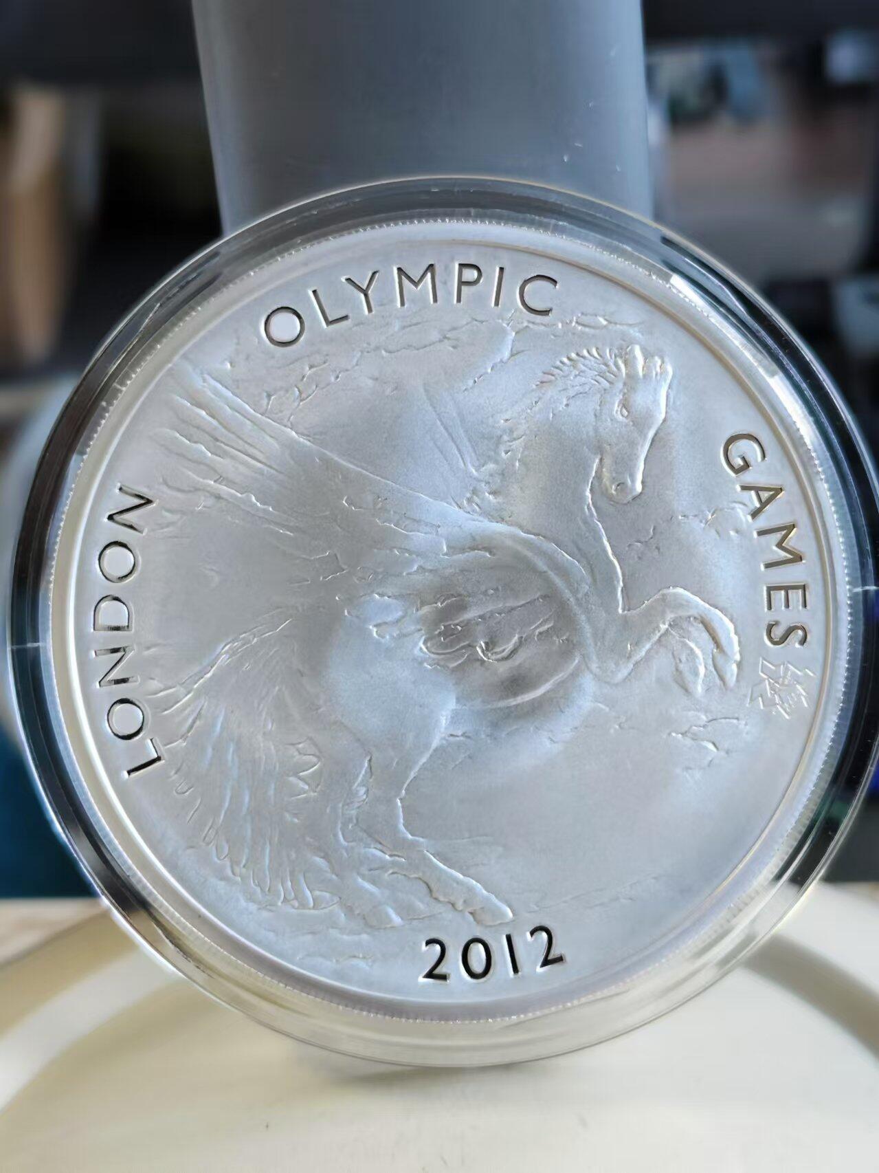 第187期拍卖 获奖币英国2012年伦敦奥运飞马精制纪念银币，荣获世界硬币大奖赛