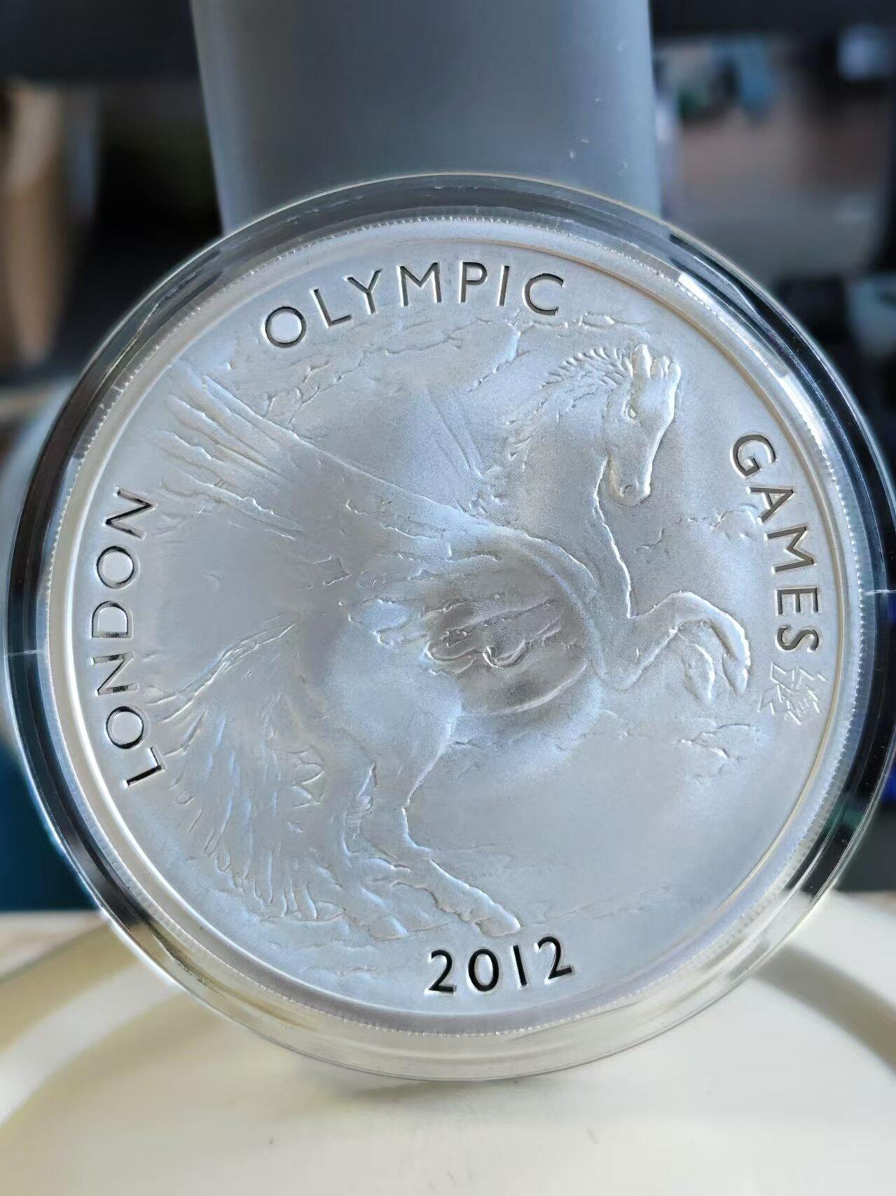 第187期拍卖 获奖币英国2012年伦敦奥运飞马精制纪念银币，荣获世界硬币大奖赛