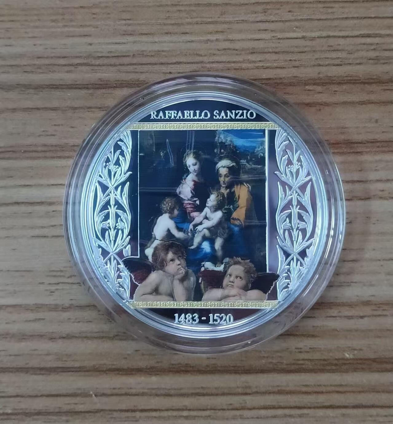 第187期拍卖 喀麦隆2020年，拉斐尔 名画-《圣母玛利亚一家》(神圣之家或母与子)，加大(直径达50mm)、镀金, 彩色精制银币. 盒证全. 发行仅300枚. 颜色有凸色现象(由于特有的着色工艺),属于正常现象. 超级精美漂亮银币.