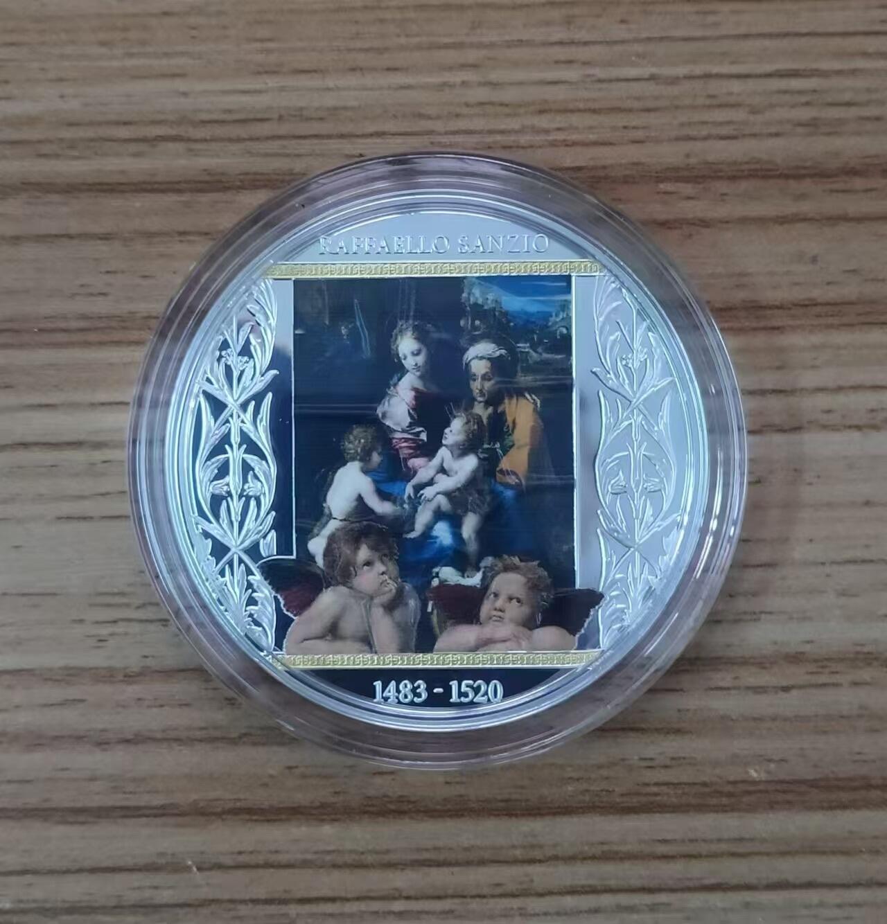 第187期拍卖 喀麦隆2020年，拉斐尔 名画-《圣母玛利亚一家》(神圣之家或母与子)，加大(直径达50mm)、镀金, 彩色精制银币. 盒证全. 发行仅300枚. 颜色有凸色现象(由于特有的着色工艺),属于正常现象. 超级精美漂亮银币.