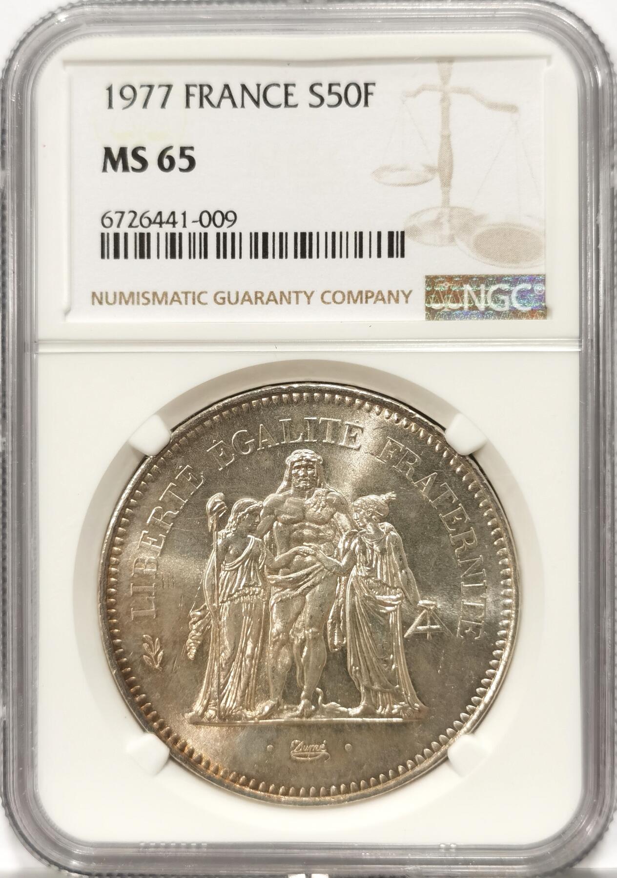 博洋堂世界钱币拍卖第093期（全场包邮） NGC MS65 法国1977大力神50法郎大银币 人物深打，双面转光，光度很好，币面霜感还在，背面淡金色包浆