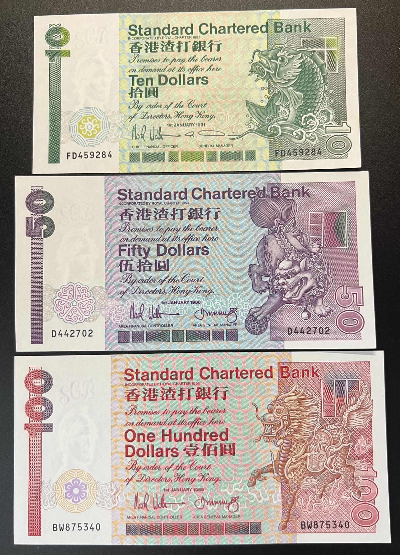 珑诚汇·乐淘淘 世界纸币拍卖 第29期 香港渣打银行1989-91年纸币 10&50&100港币 长棍 拾圓有潮斑 伍拾圓左下角轻微压痕 边缘轻微荧光反应 UNC