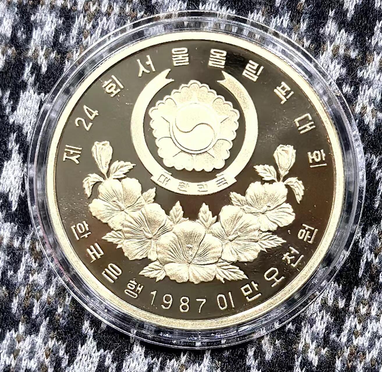 北京马甸外国币专卖微拍第127期，外国金银币专场，陆续上新，欢迎关注 1988年韩国汉城奥运会1盎司金币，重量：16.8克，成色：925