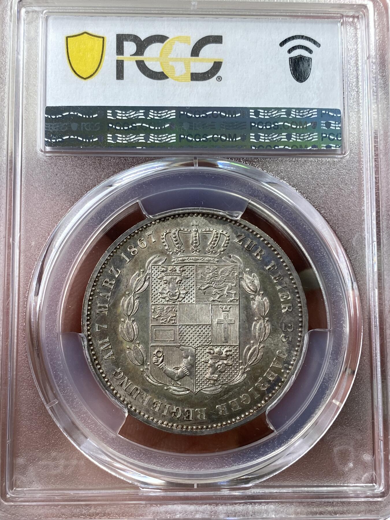 万国钱币拍卖第035期（金银流霞●万国秋季大拍） PCGS MS64 1867年德国梅克伦堡-什未林盾徽流通1泰勒 盾徽非常华丽的小邦泰勒 渐变式七彩环绕  镜面感极强 顶级收藏品质