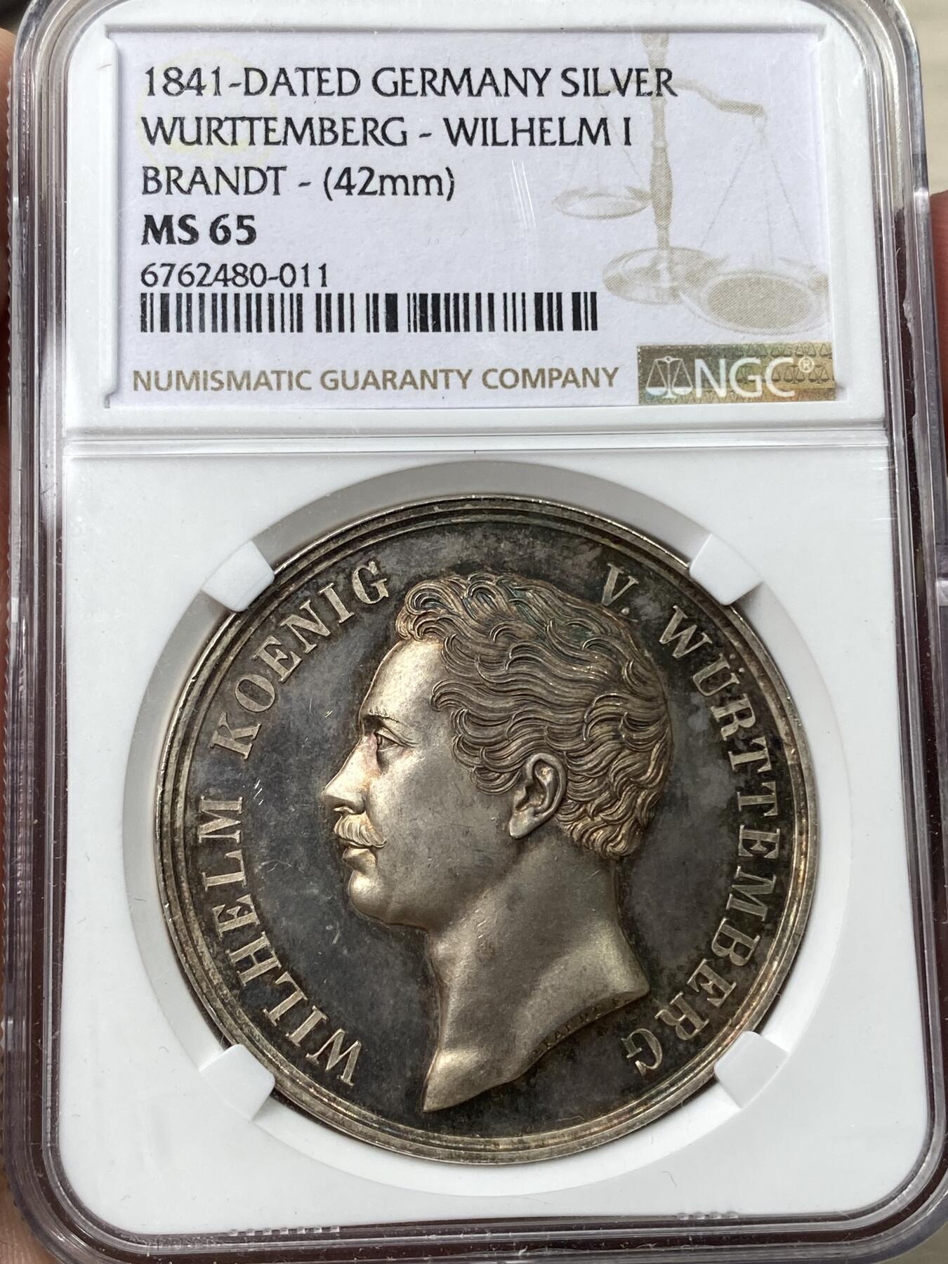 万国钱币拍卖第035期（金银流霞●万国秋季大拍） NGC MS65 1841年德国符腾堡威廉一世登基加冕25周年纪念大银章 高浮雕小邦名誉品种 每一根发丝都生动鲜明 全身金彩 41.5MM 36.7G 