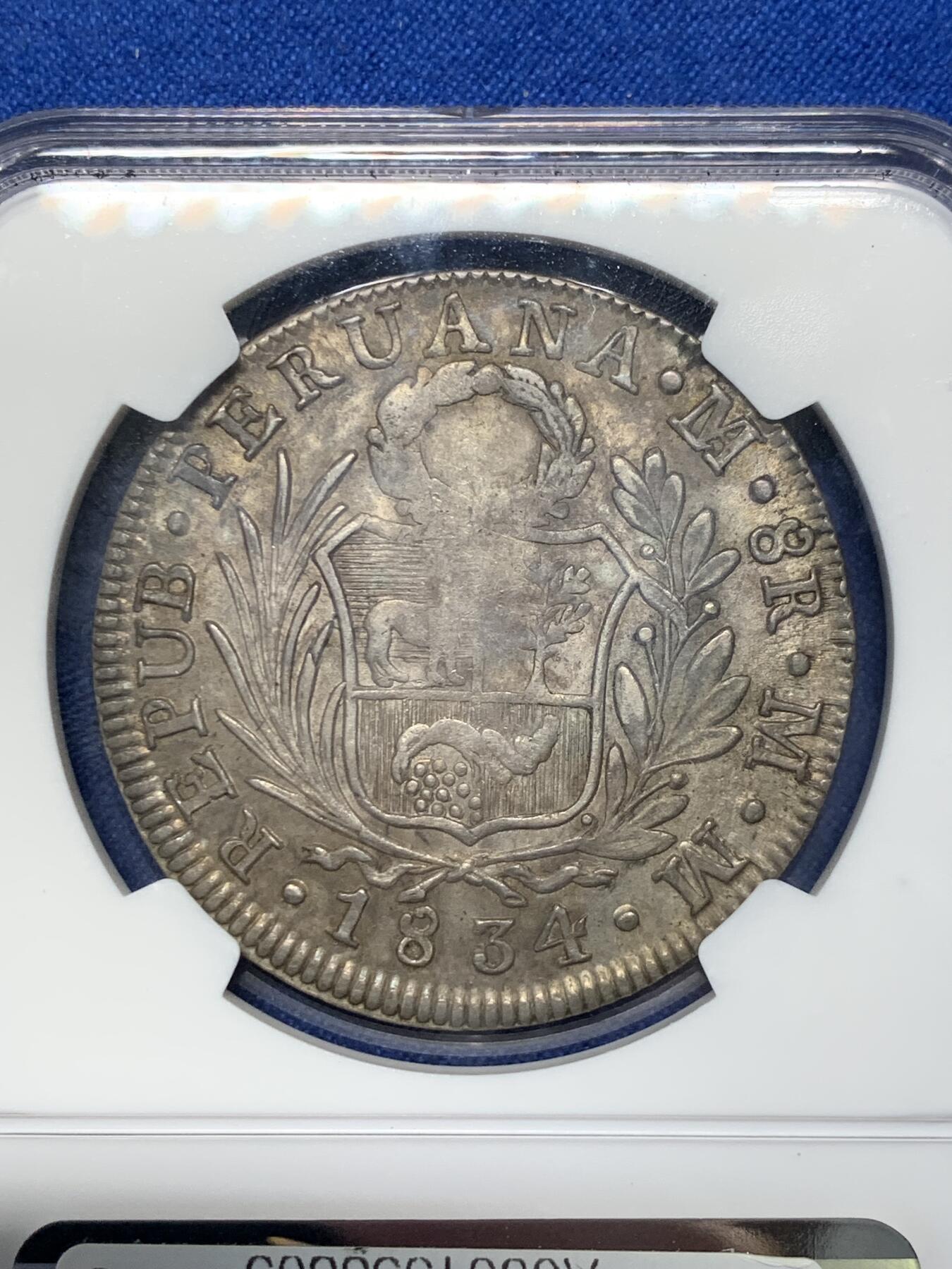 《竞宝斋》第313场 周日，周一 2场连拍 （全场包邮） NGC AU55 秘鲁1834年利马厂站人8R大银币，原味老包浆，滴水未沾。此品种普遍弱打，高分也无好品。早期南美主币大银难得