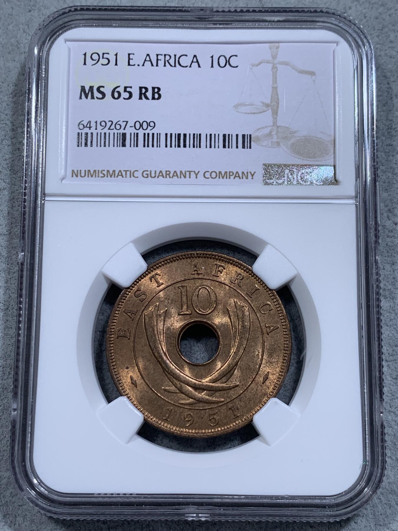 《竞宝斋》第314场 周日，周一，周二  3场连拍 （全场包邮） NGC MS65RB 冠军分 英属东非1951年10分中孔大铜币，铜光不输RD，卷拆送评，此品种上65非常难得。收藏级冠军品质