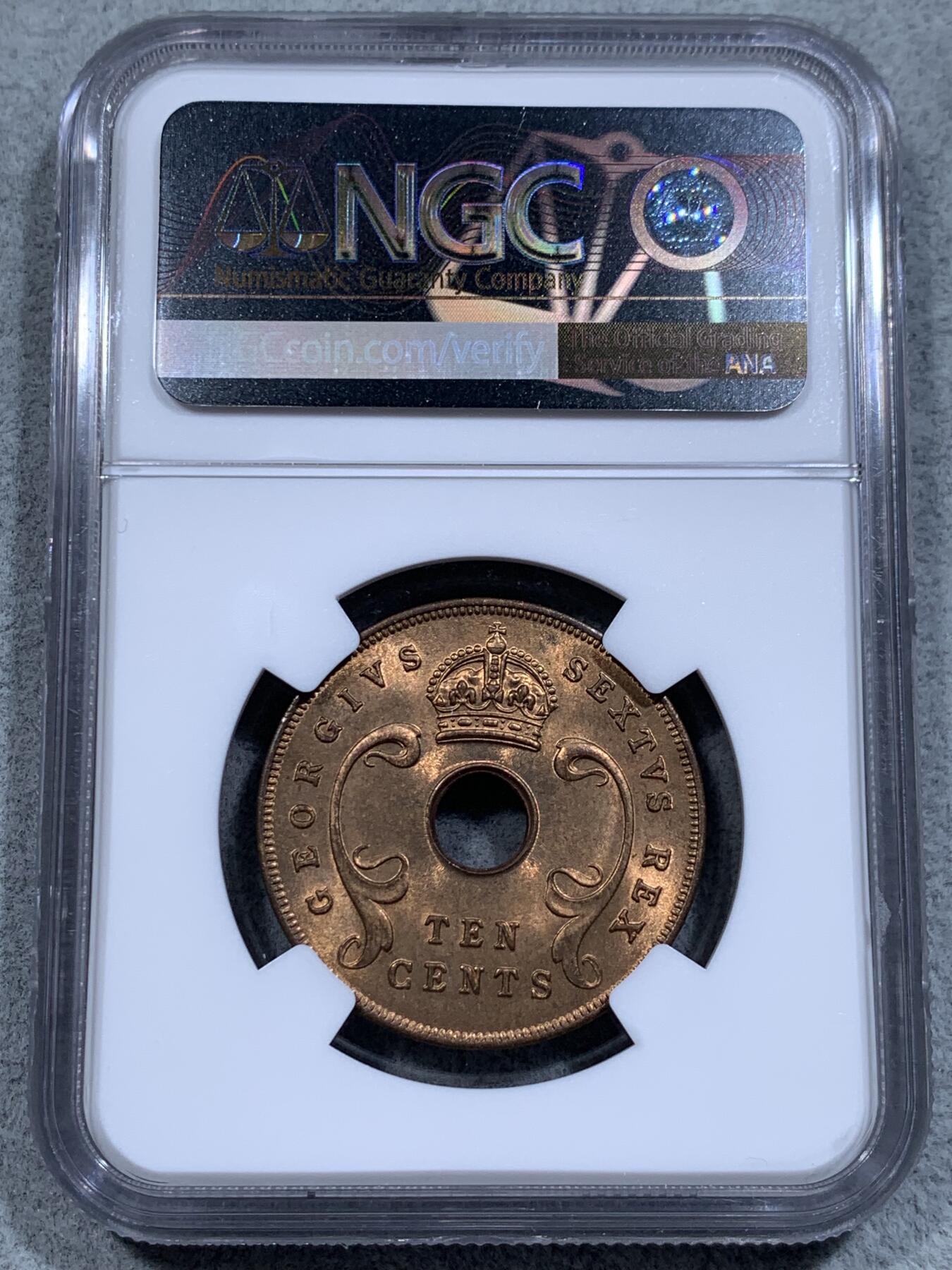 《竞宝斋》第314场 周日，周一，周二  3场连拍 （全场包邮） NGC MS65RB 冠军分 英属东非1951年10分中孔大铜币，铜光不输RD，卷拆送评，此品种上65非常难得。收藏级冠军品质
