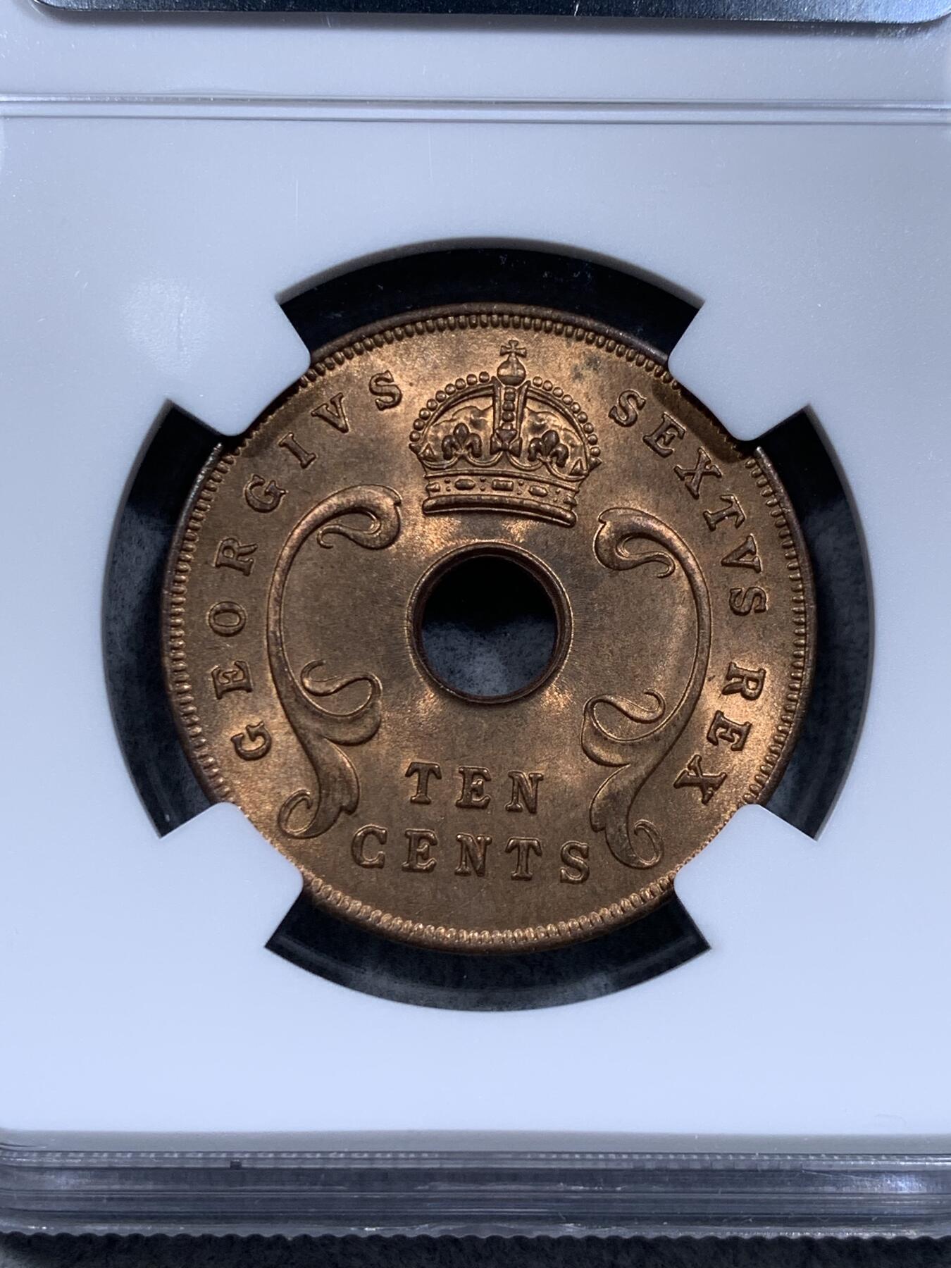 《竞宝斋》第314场 周日，周一，周二  3场连拍 （全场包邮） NGC MS65RB 冠军分 英属东非1951年10分中孔大铜币，铜光不输RD，卷拆送评，此品种上65非常难得。收藏级冠军品质