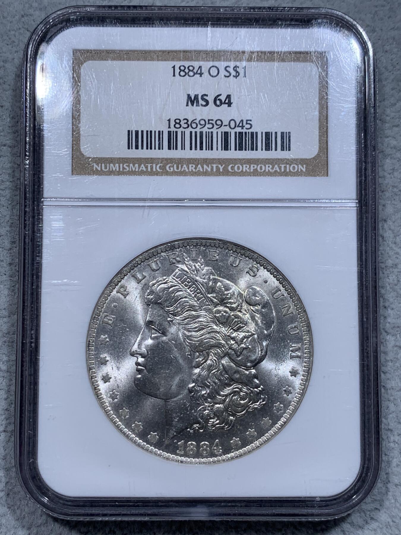 《竞宝斋》第315场 周日，周一，周二  3场连拍 （全场包邮） NGC MS64 美国1884年摩根银币O版 币面清爽干净又漂亮，状态极佳。NGC老白盒严评无官网图。
