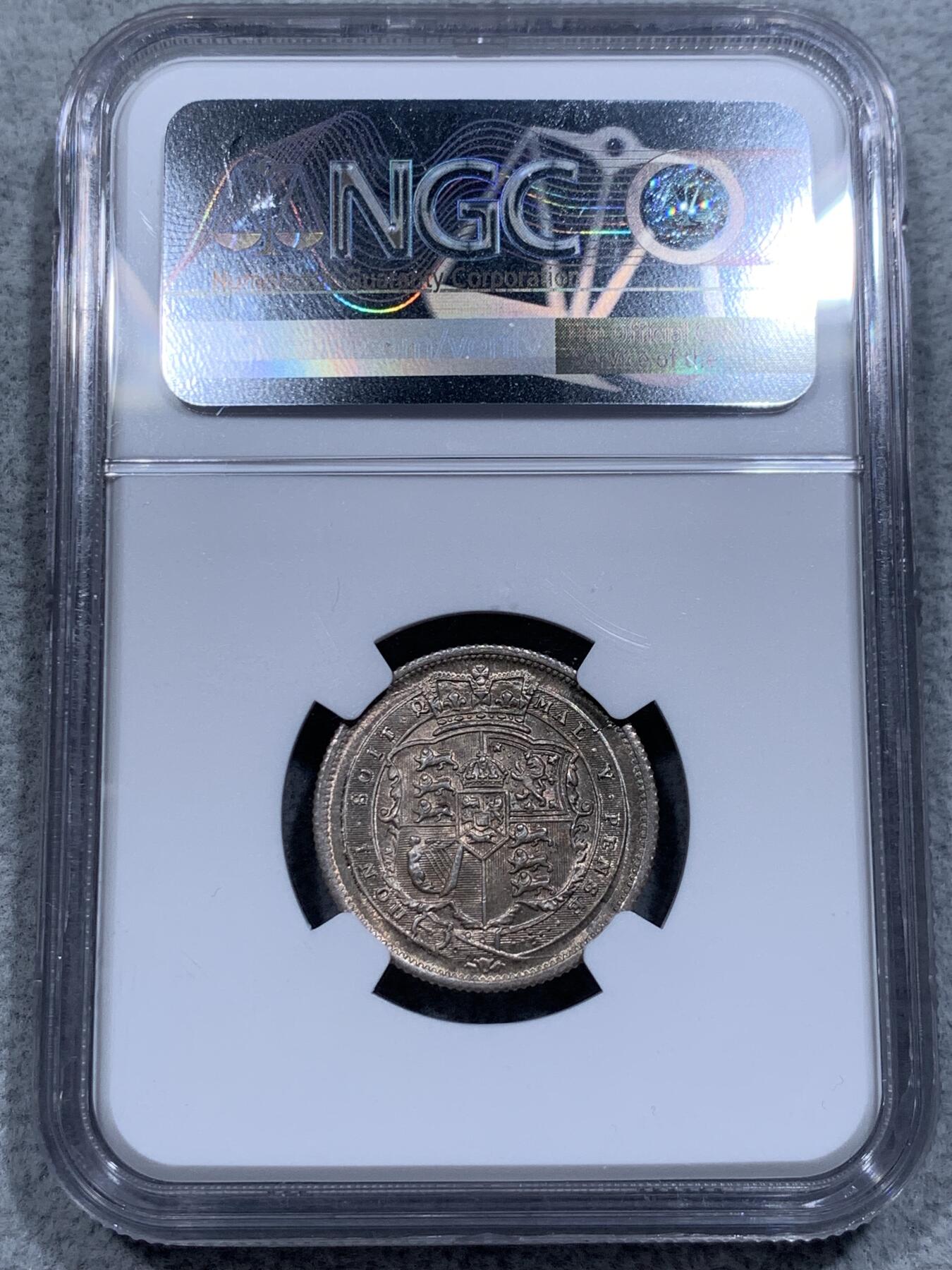 《竞宝斋》第315场 周日，周一，周二  3场连拍 （全场包邮） NGC MS65 英国1816年 乔治三世牛头1先令银币。好包浆好状态，来自皮斯特鲁奇的经典设计，分数够玩了，稀奇有2750的落槌价。